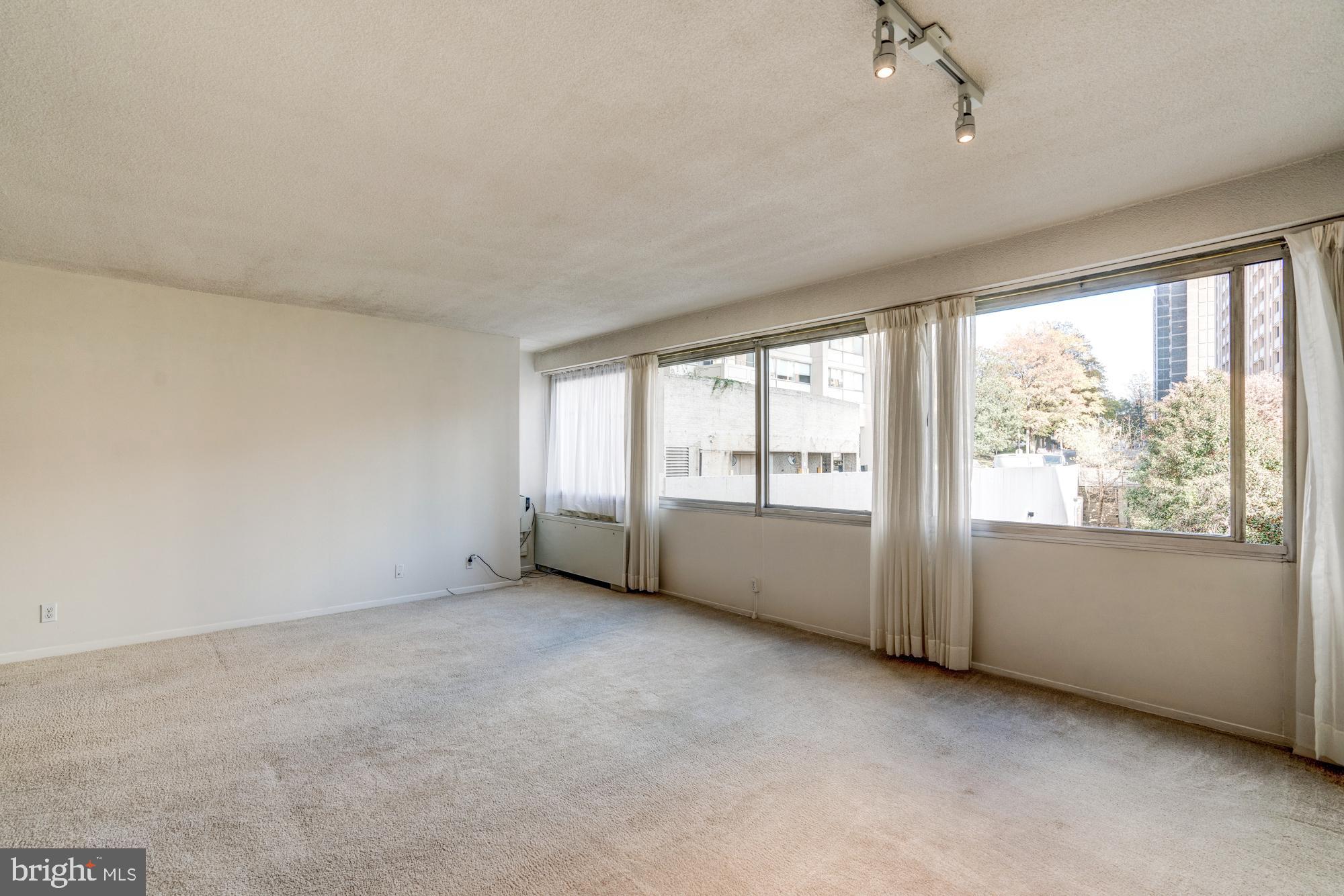 4515 Willard Avenue, Unit 719S Chevy Chase, MD 20815 - Photo 23 of 44 a view of an empty room with a window