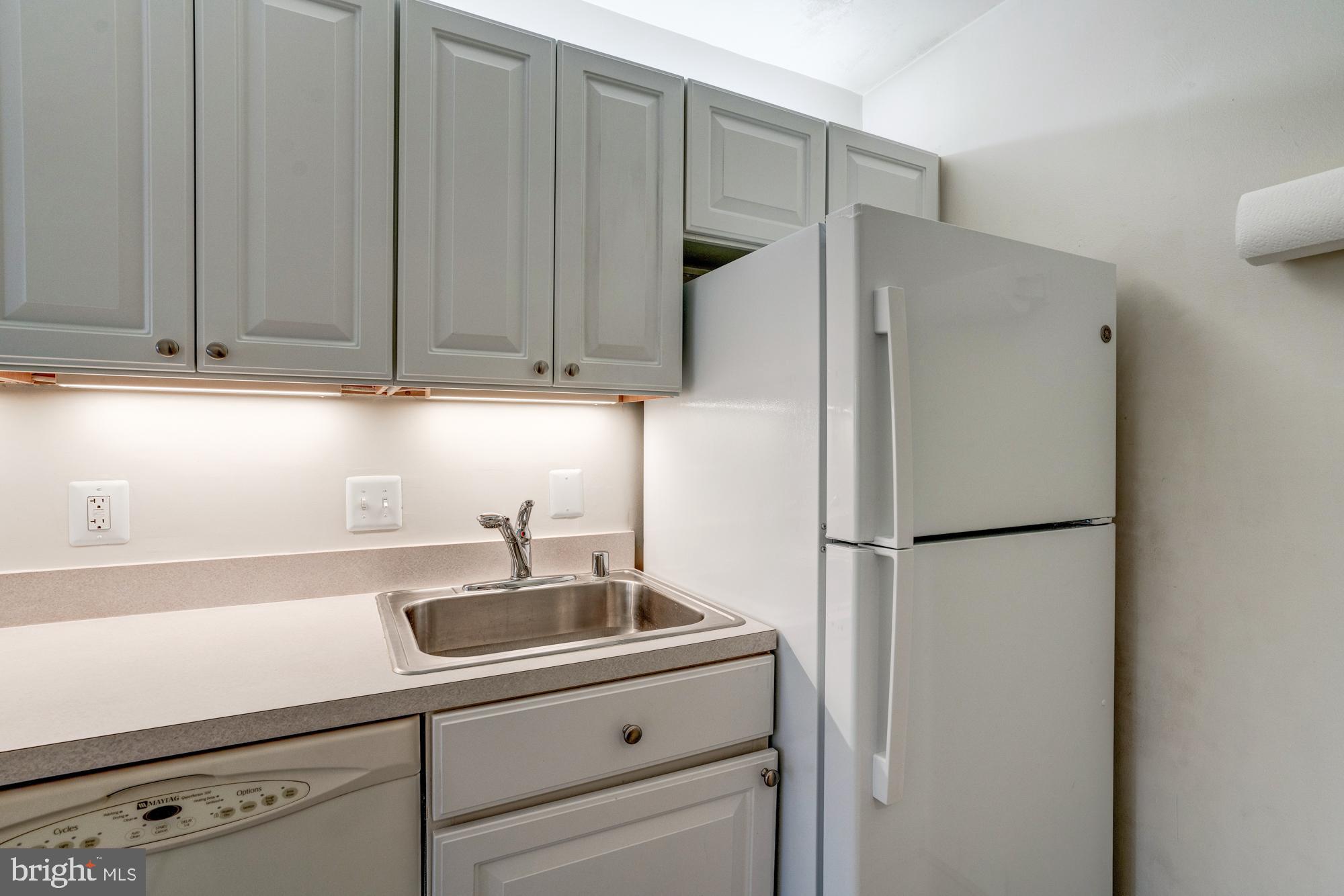 4515 Willard Avenue, Unit 719S Chevy Chase, MD 20815 - Photo 29 of 44 a white refrigerator freezer sitting inside of a kitchen