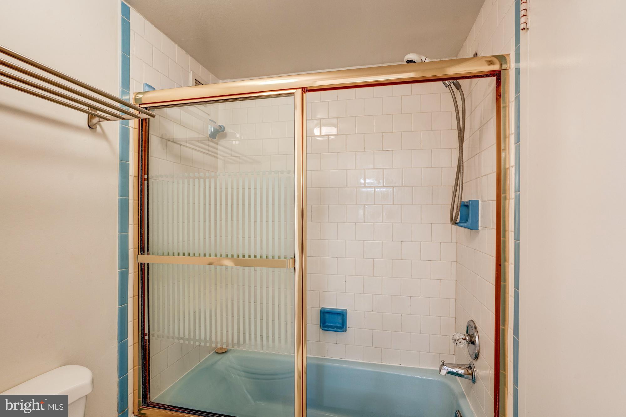 4515 Willard Avenue, Unit 719S Chevy Chase, MD 20815 - Photo 32 of 44 a bathroom with a glass shower door