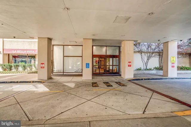 a spacious bathroom with a granite countertop sink and a large mirror