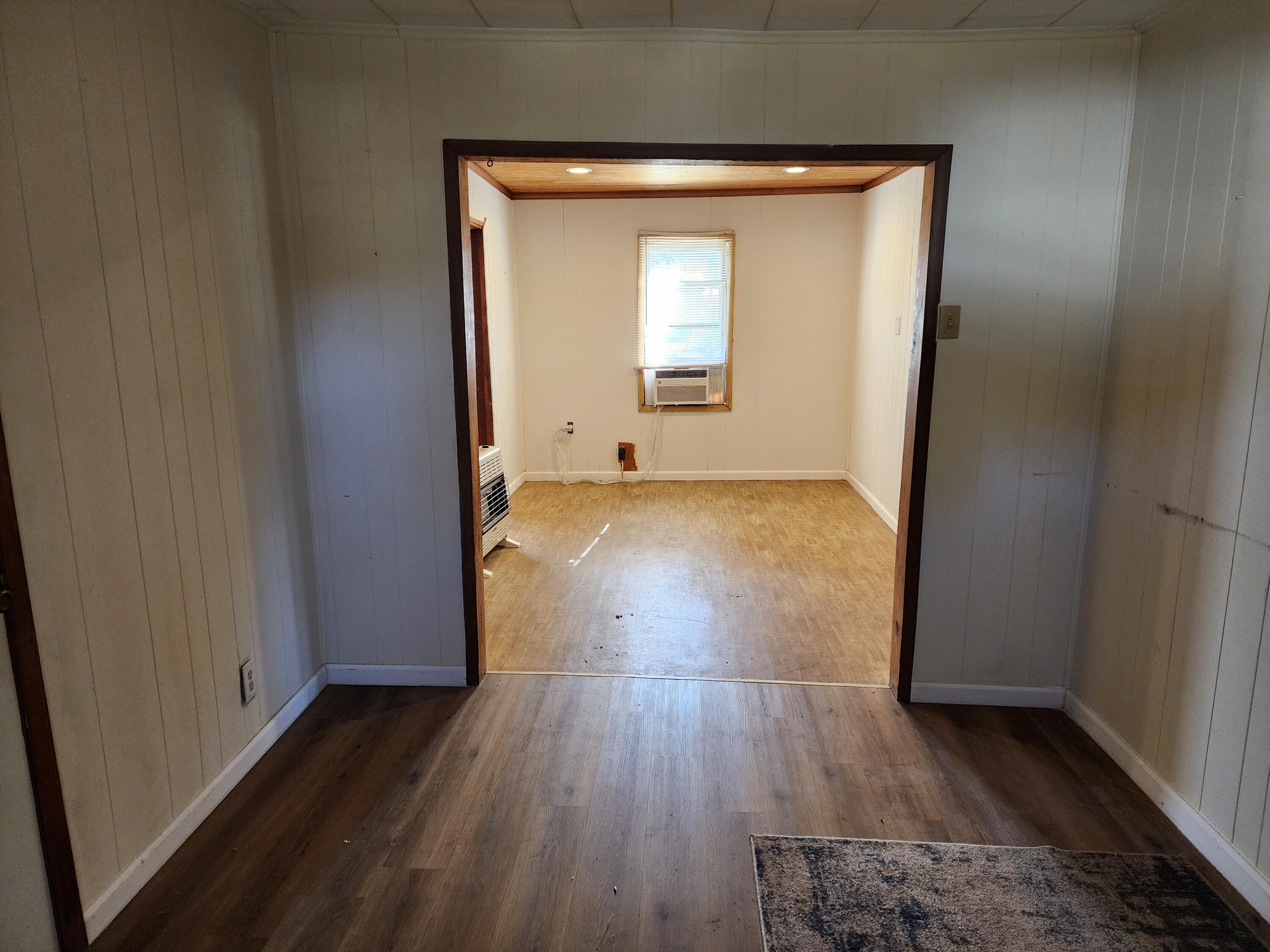 6181 Bethany Drive Crestview, FL 32539 - Photo 12 of 28 a view of a room with wooden floor and a window