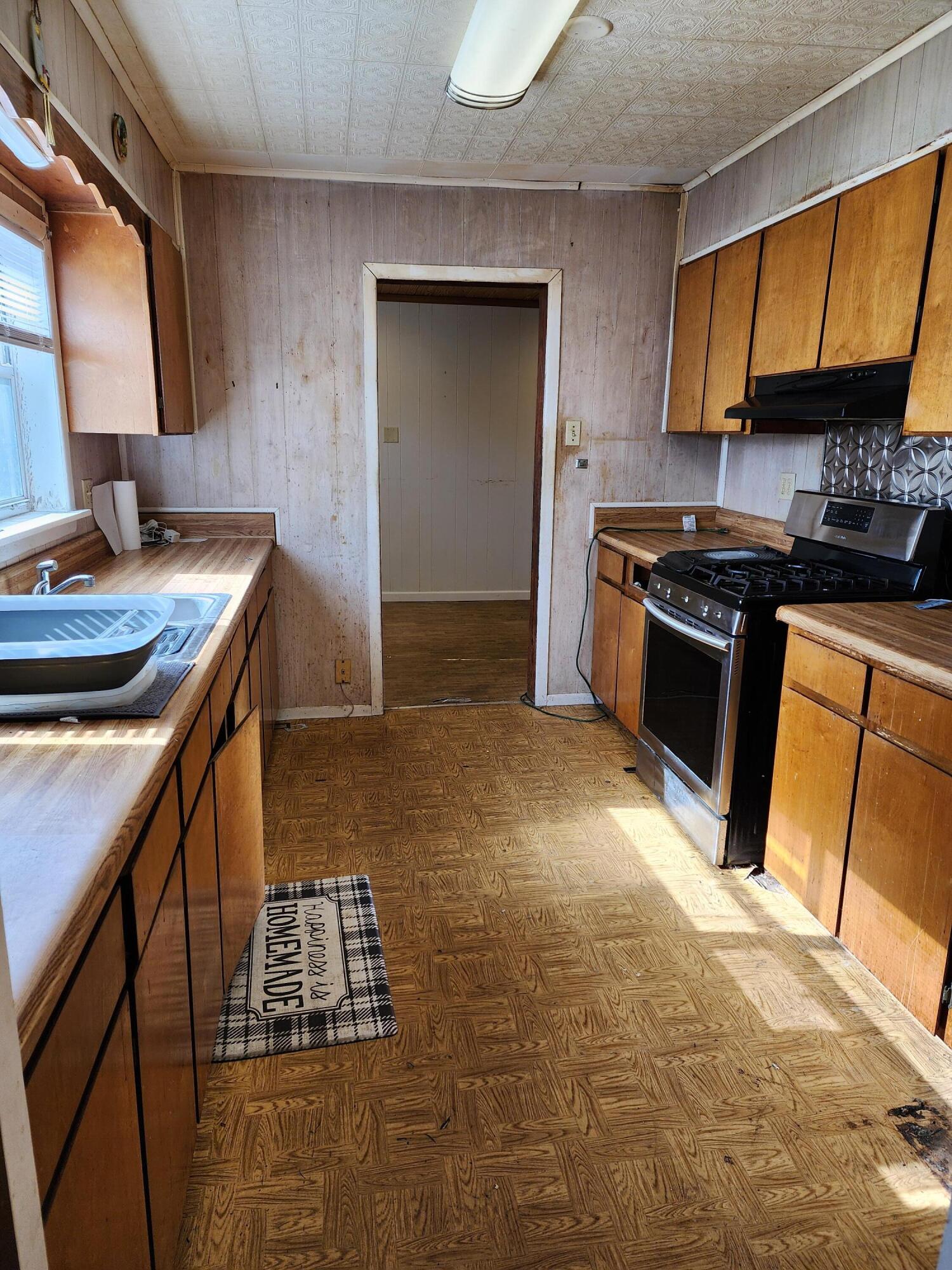 6181 Bethany Drive Crestview, FL 32539 - Photo 15 of 28 a kitchen with stainless steel appliances granite countertop a sink stove and cabinets