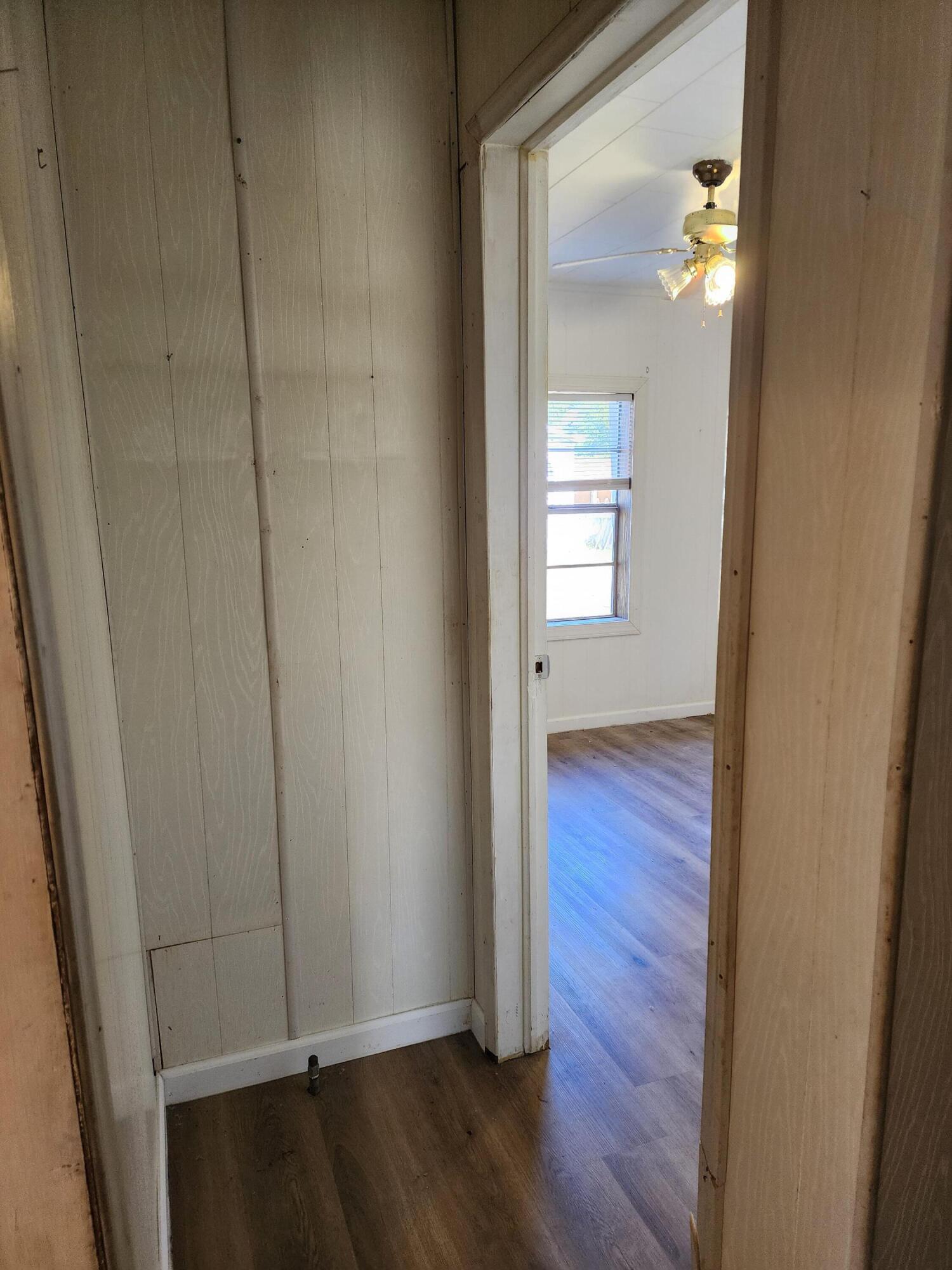 6181 Bethany Drive Crestview, FL 32539 - Photo 28 of 28 an empty room with wooden floor and closet