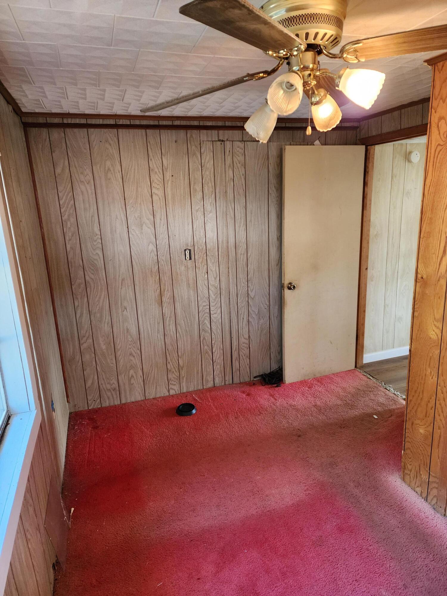 6181 Bethany Drive Crestview, FL 32539 - Photo 6 of 28 a view of a room with a chandelier fan and wooden floor