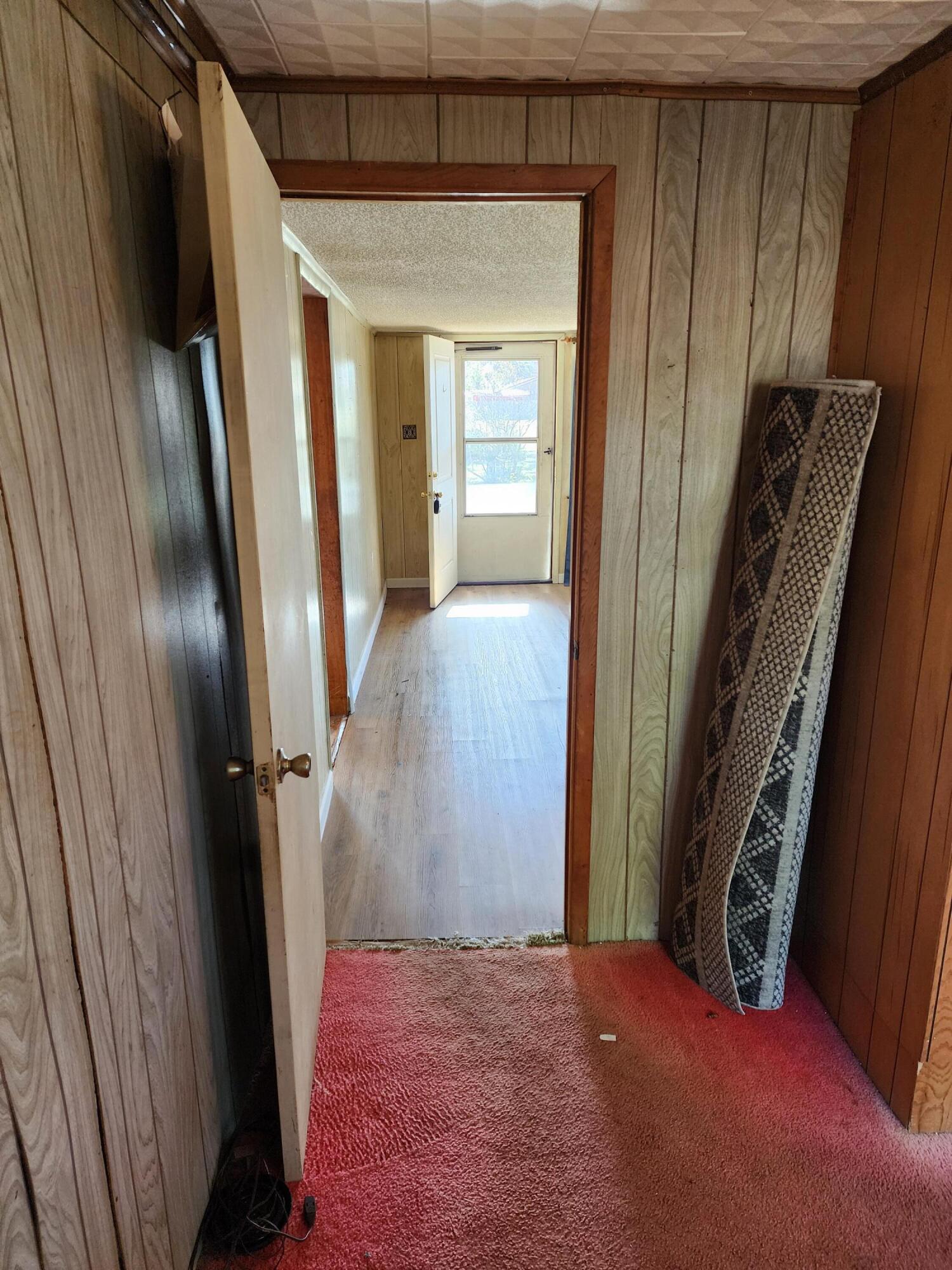 6181 Bethany Drive Crestview, FL 32539 - Photo 8 of 28 a view of a hallway with wooden floor and staircase