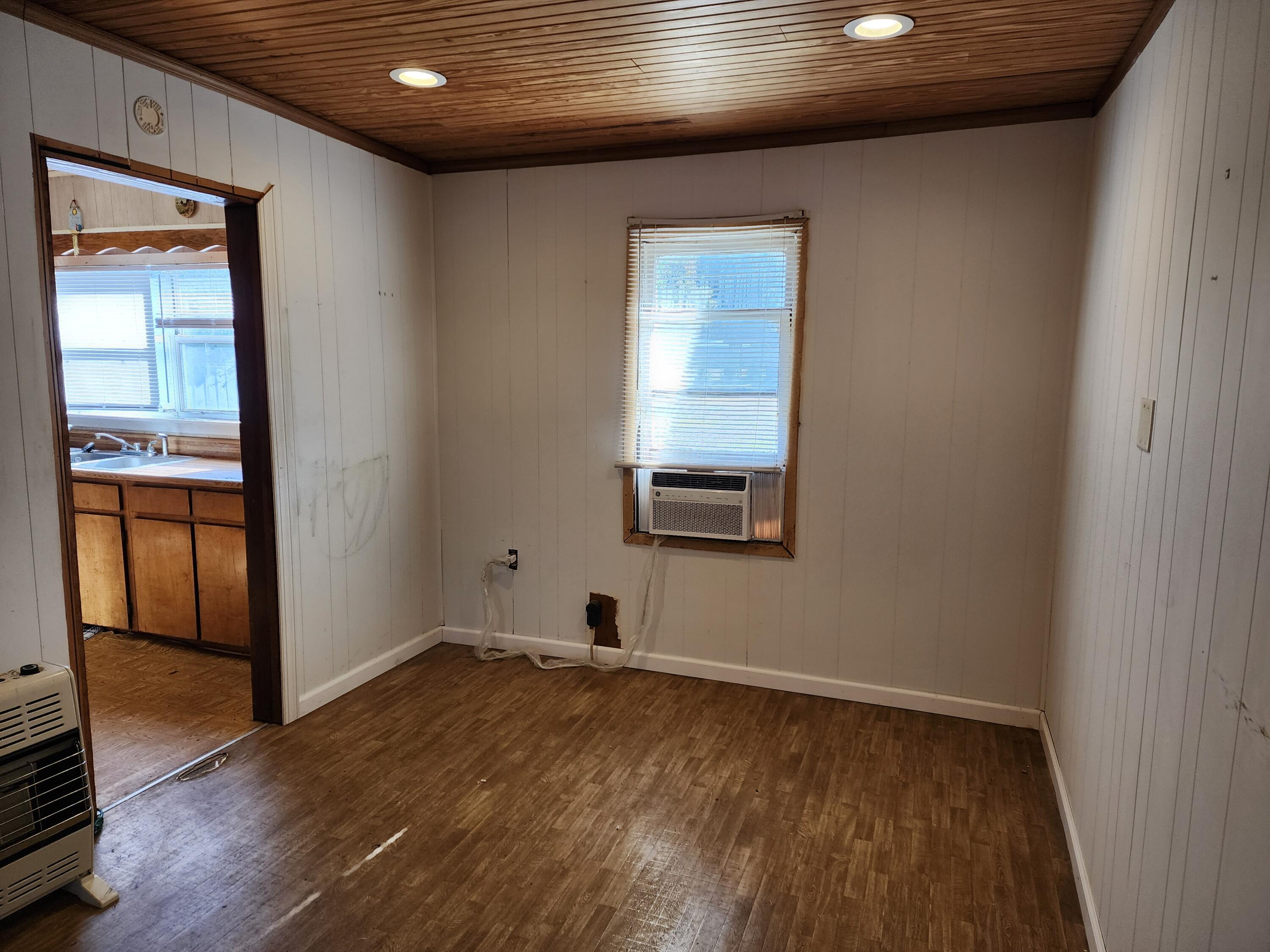 6181 Bethany Drive Crestview, FL 32539 - Photo 9 of 28 a view of empty room with wooden floor and fan