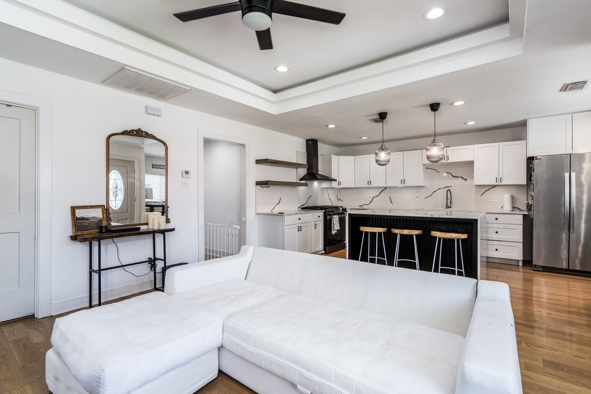 810 Jerry Street Houston, TX 77022 - Photo 6 of 20 a kitchen with stainless steel appliances kitchen island granite countertop a table chairs in it and wooden floors