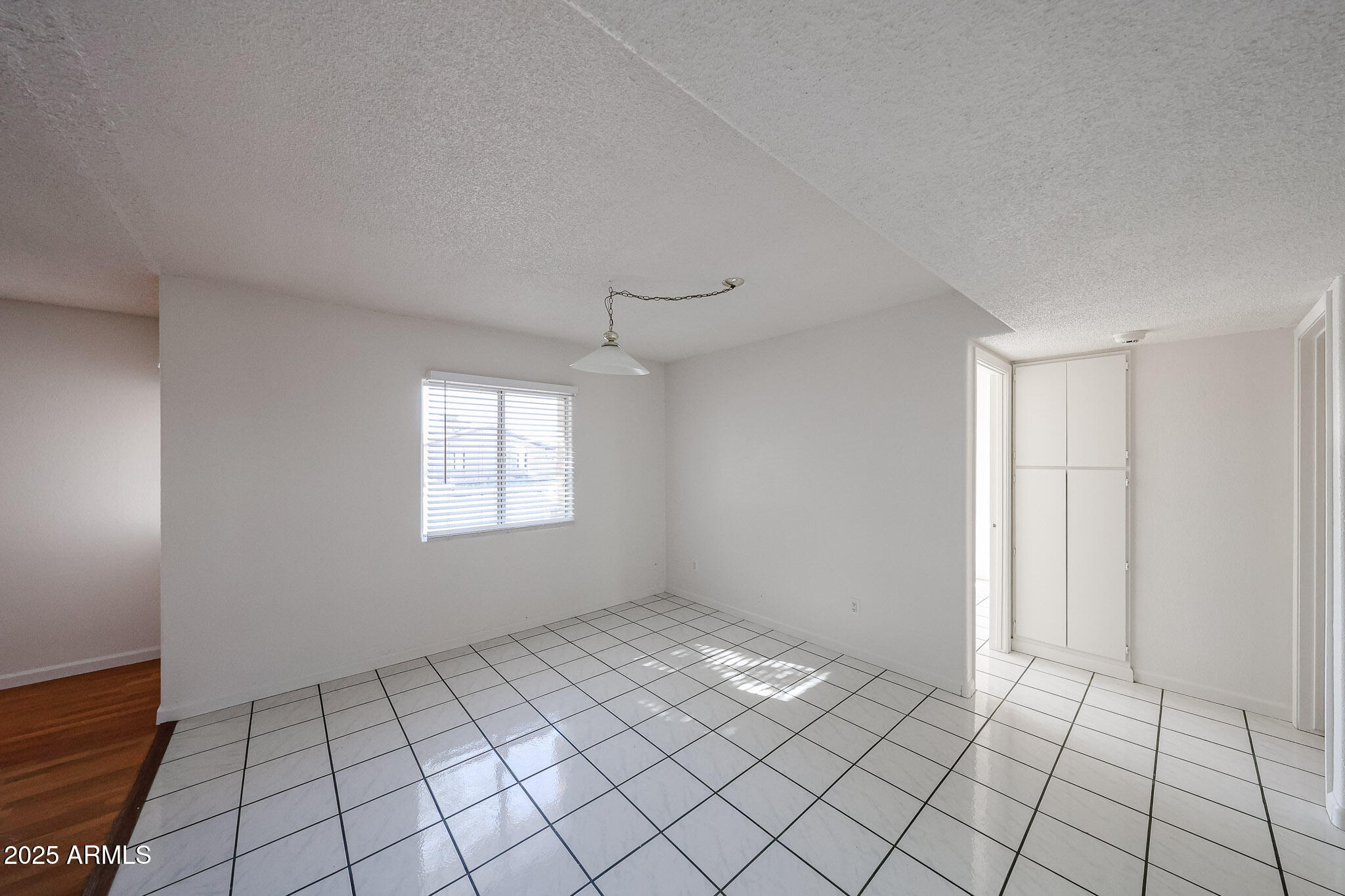 3408 West Port Au Prince Lane Phoenix, AZ 85053 - Photo 13 of 61 a view of an empty room and window
