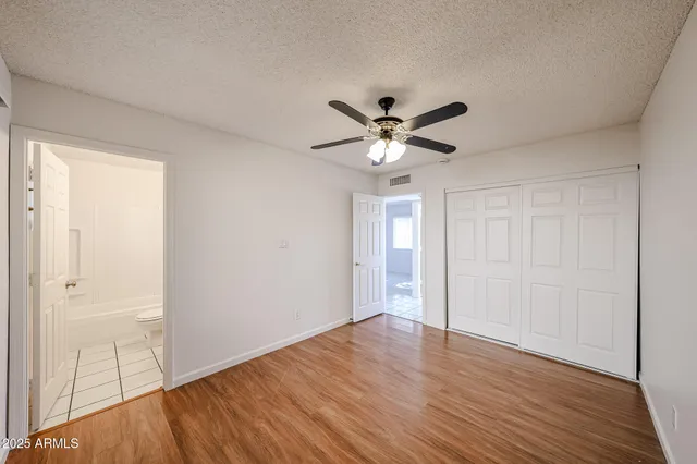 a white toilet sitting next to a bathroom sink