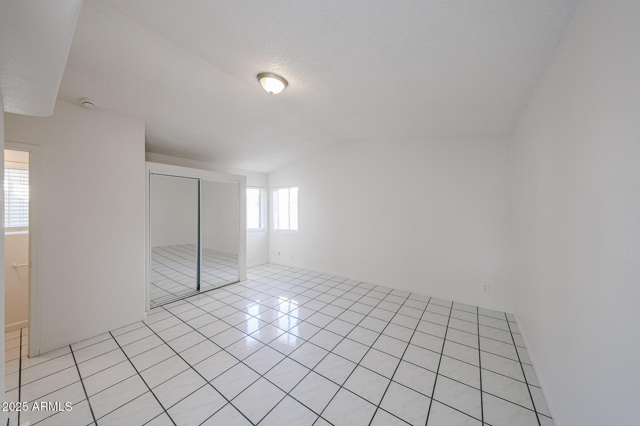 3408 West Port Au Prince Lane Phoenix, AZ 85053 - Photo 32 of 61 a view of an empty room and window