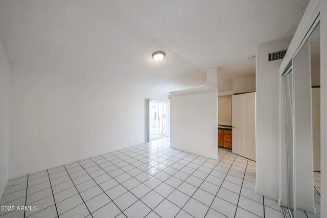 a view of a room with wooden floor and staircase