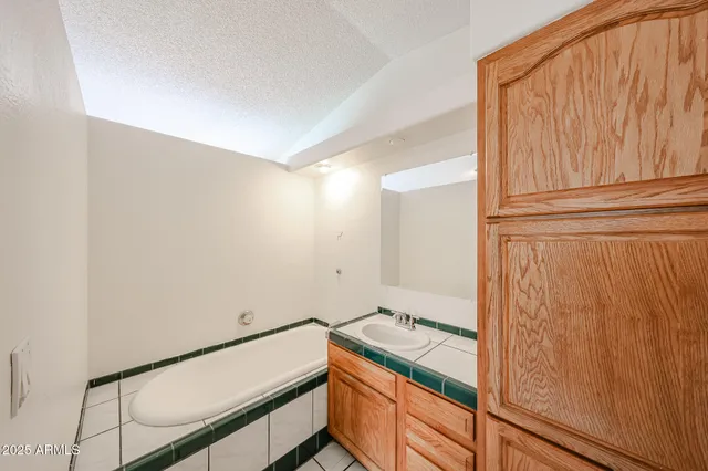 a view of backyard with patio