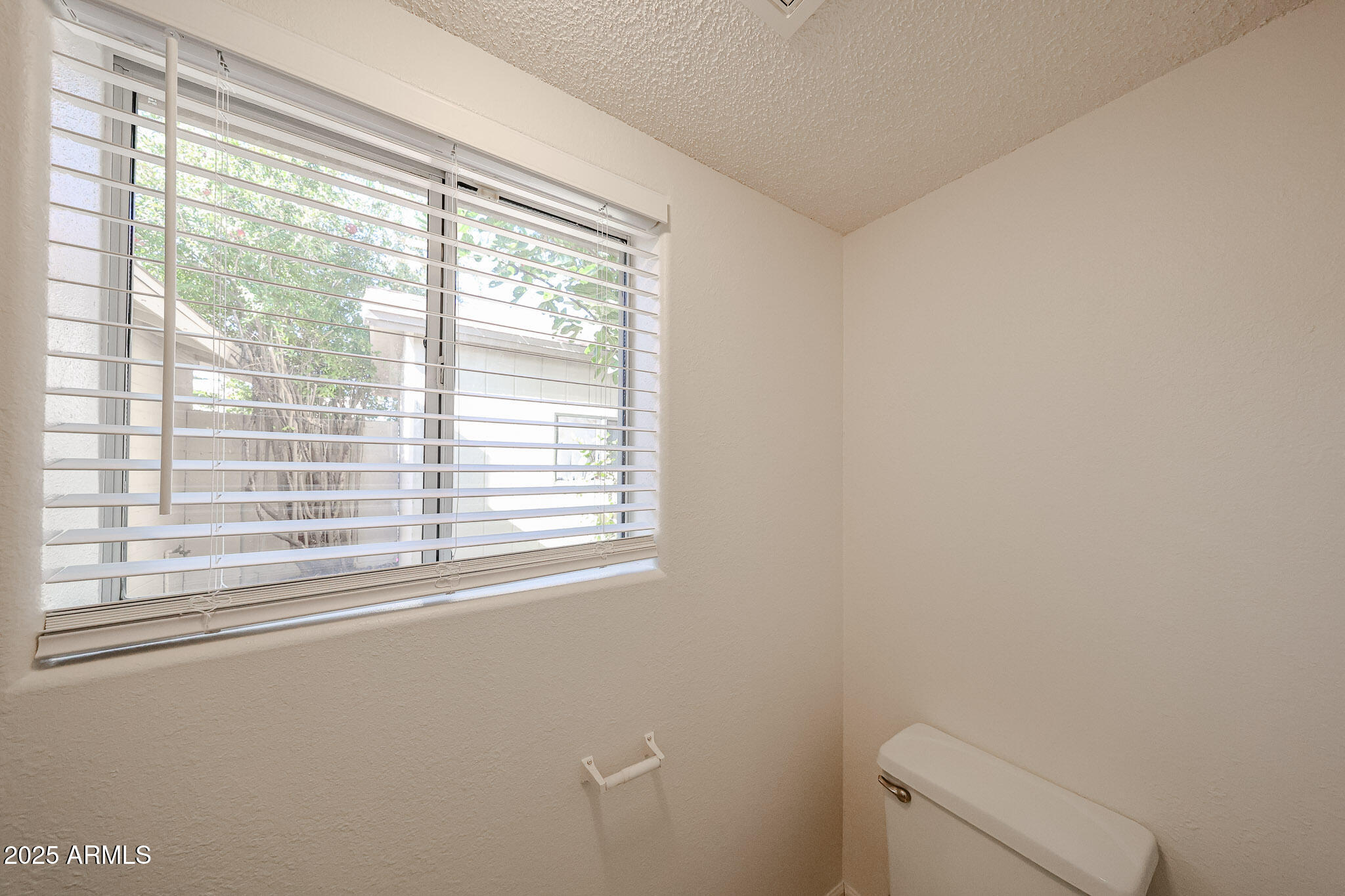 3408 West Port Au Prince Lane Phoenix, AZ 85053 - Photo 39 of 61 a view of a small space with a window