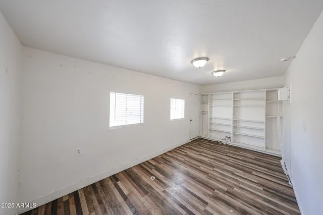 a view of a patio with table and chairs and potted plants