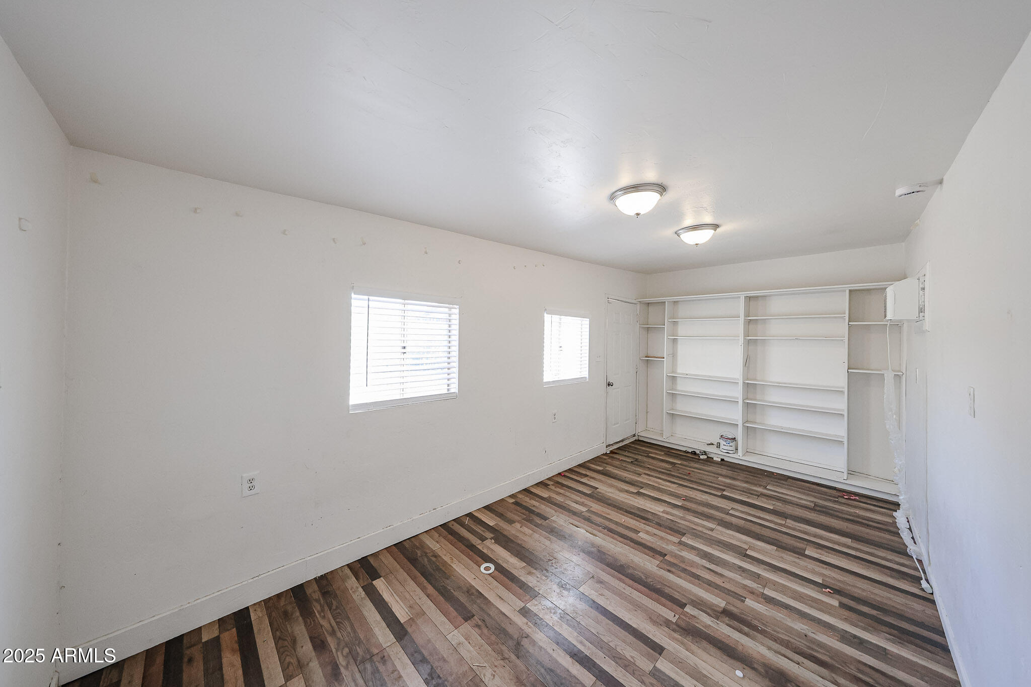 3408 West Port Au Prince Lane Phoenix, AZ 85053 - Photo 41 of 61 wooden floor in an empty room