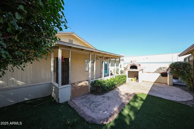 a view of a chair and table in the patio
