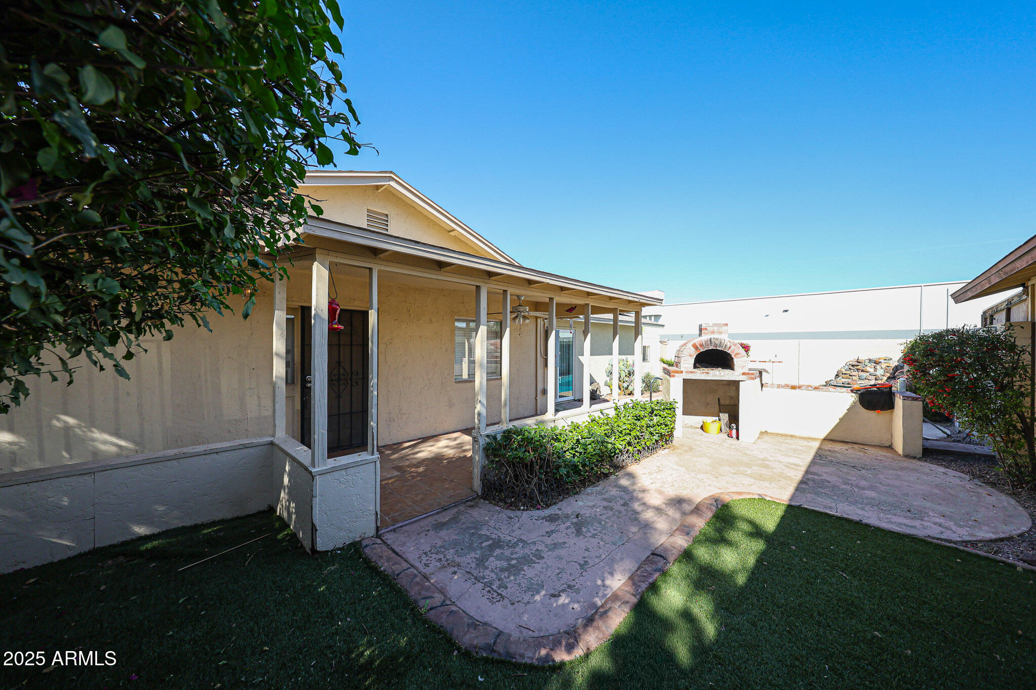 3408 West Port Au Prince Lane Phoenix, AZ 85053 - Photo 44 of 61 a front view of a house with garden