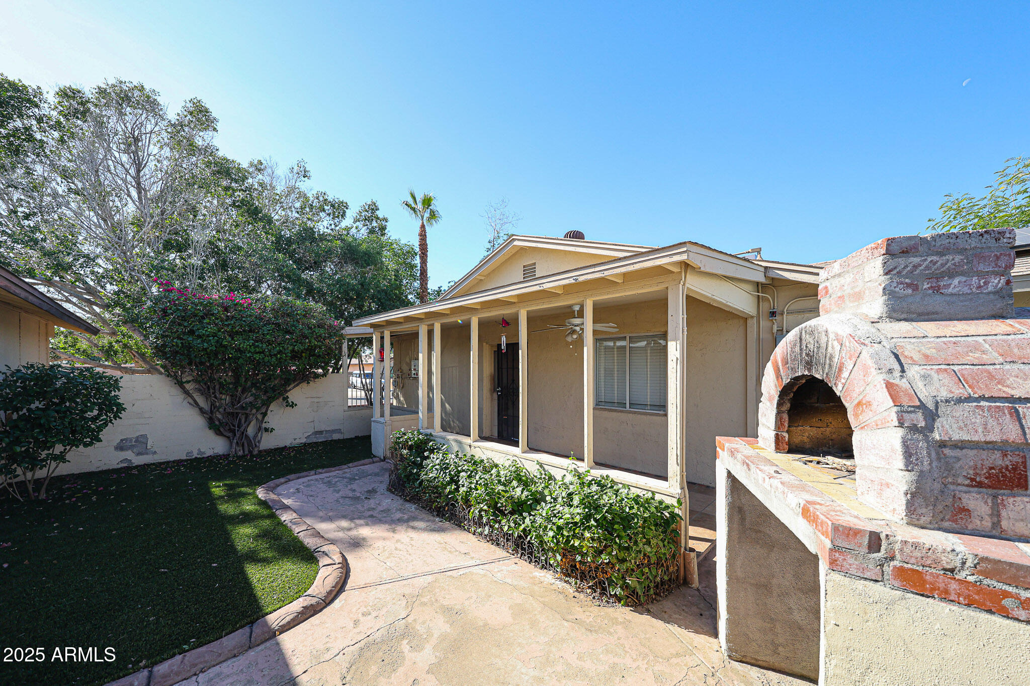 3408 West Port Au Prince Lane Phoenix, AZ 85053 - Photo 45 of 61 a view of a house with a yard