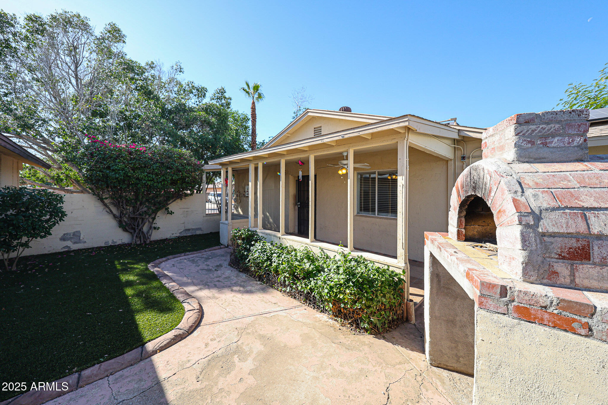 3408 West Port Au Prince Lane Phoenix, AZ 85053 - Photo 49 of 61 a front view of a house with a yard