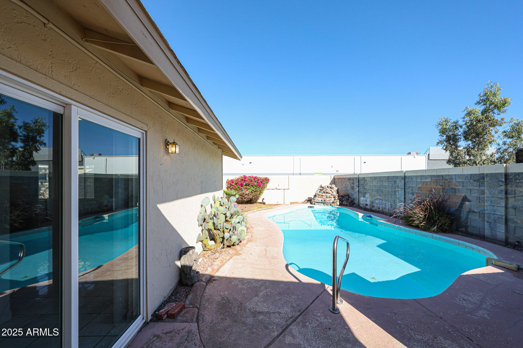 3408 West Port Au Prince Lane Phoenix, AZ 85053 - Photo 50 of 61 a view of a patio with table and chairs and potted plants