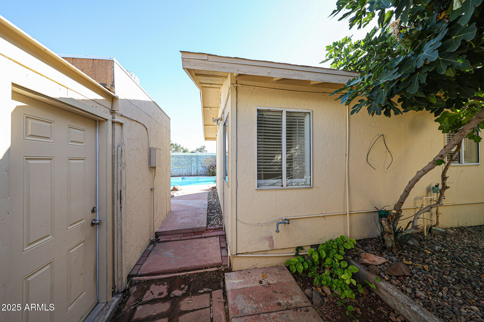 3408 West Port Au Prince Lane Phoenix, AZ 85053 - Photo 57 of 61 a view of a house with a small yard