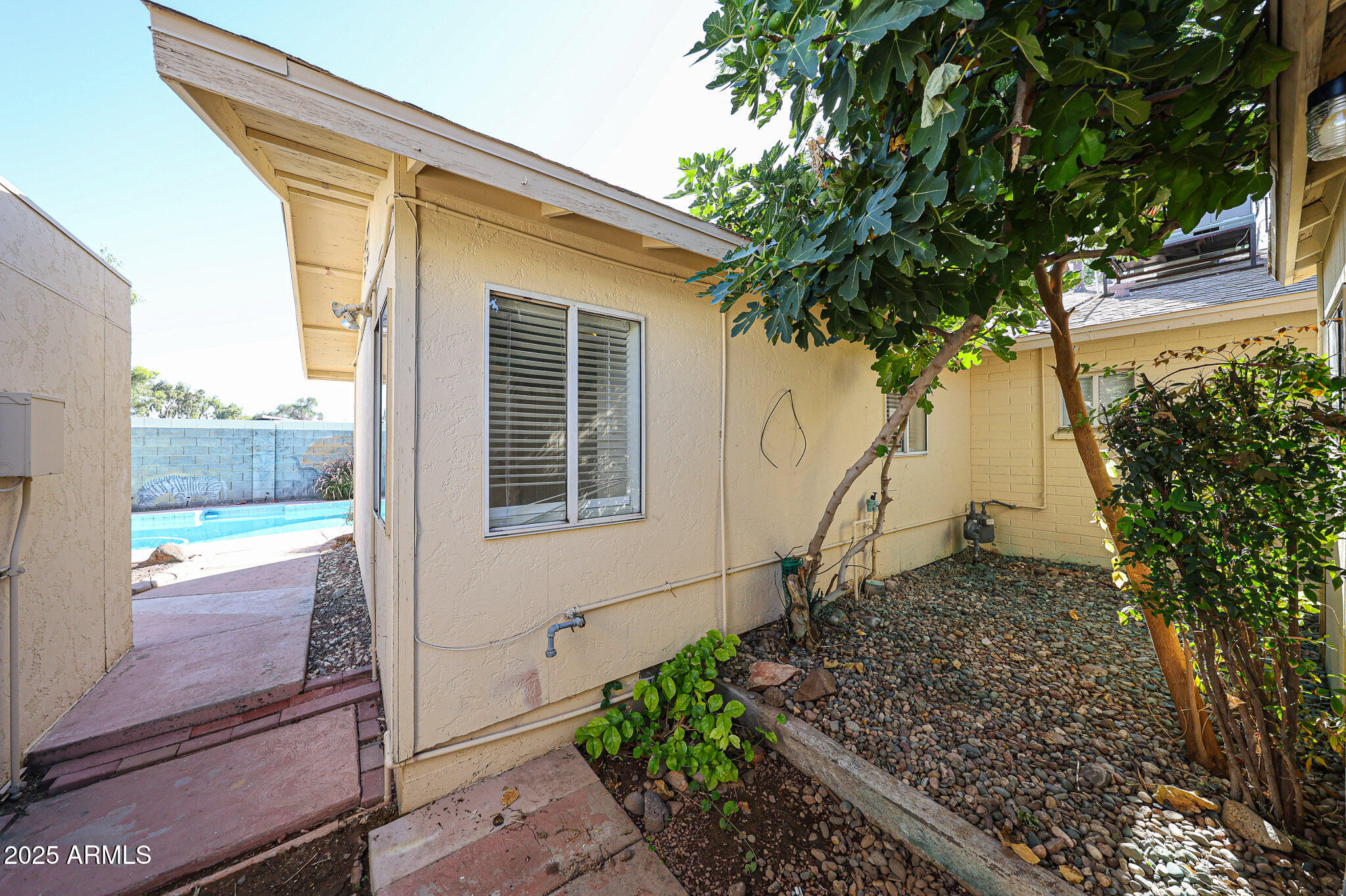 3408 West Port Au Prince Lane Phoenix, AZ 85053 - Photo 58 of 61 a house view with a garden space