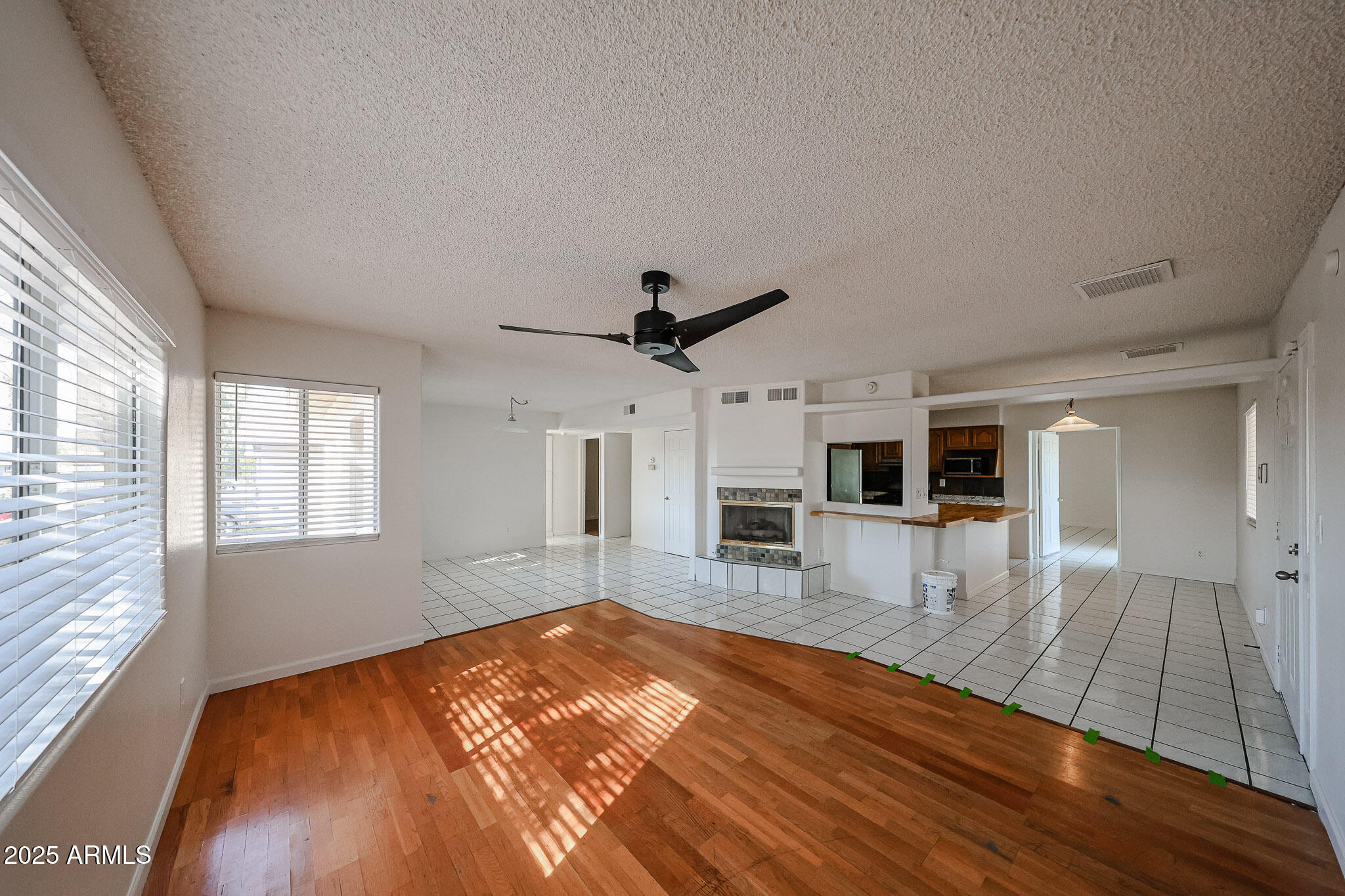 3408 West Port Au Prince Lane Phoenix, AZ 85053 - Photo 6 of 61 a view of a living room hardwood floor and a kitchen