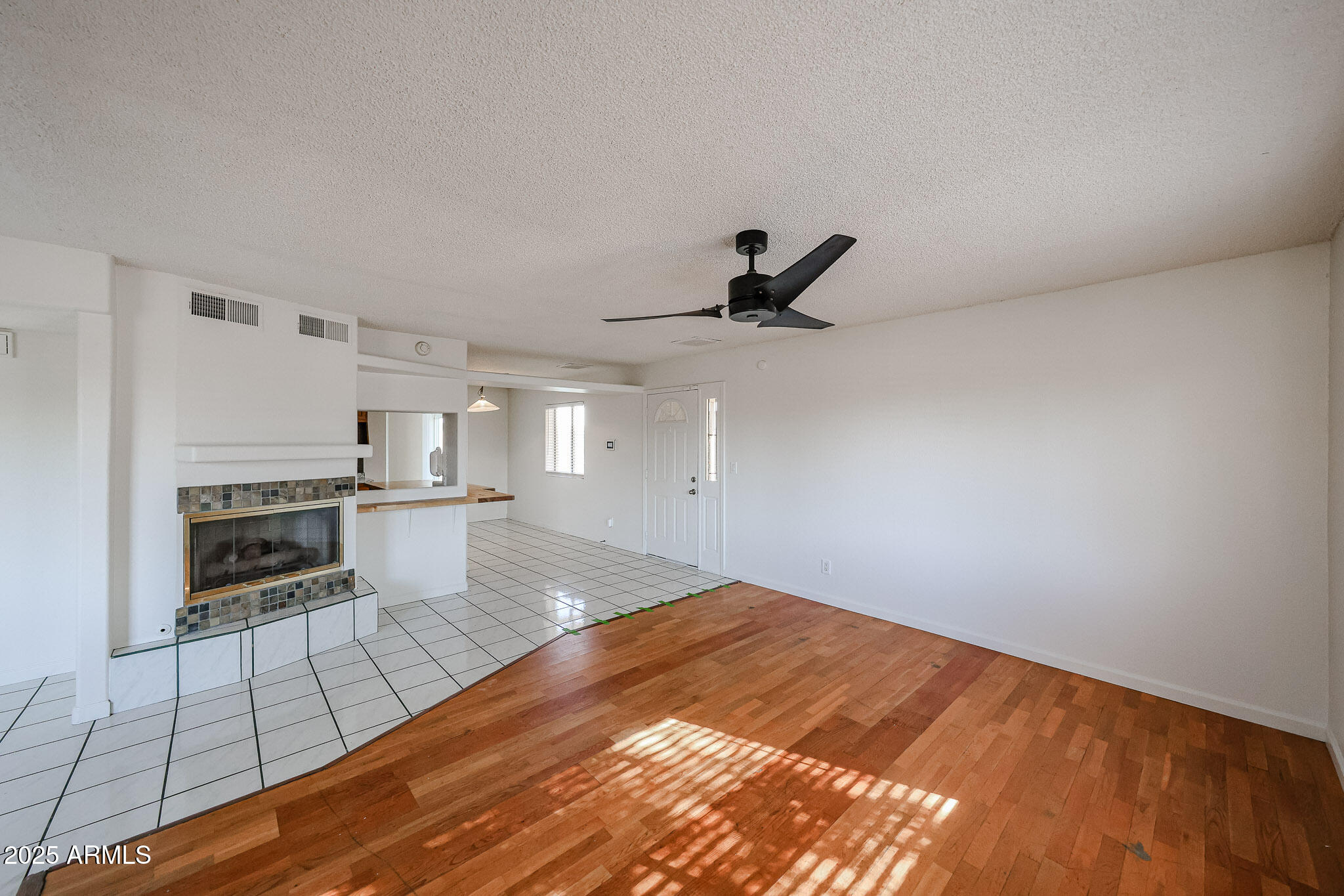 3408 West Port Au Prince Lane Phoenix, AZ 85053 - Photo 10 of 61 a open kitchen with white cabinets and stainless steel appliances