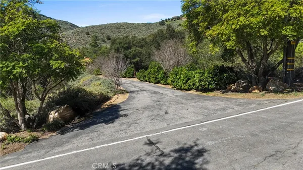 a view of a street with a trees