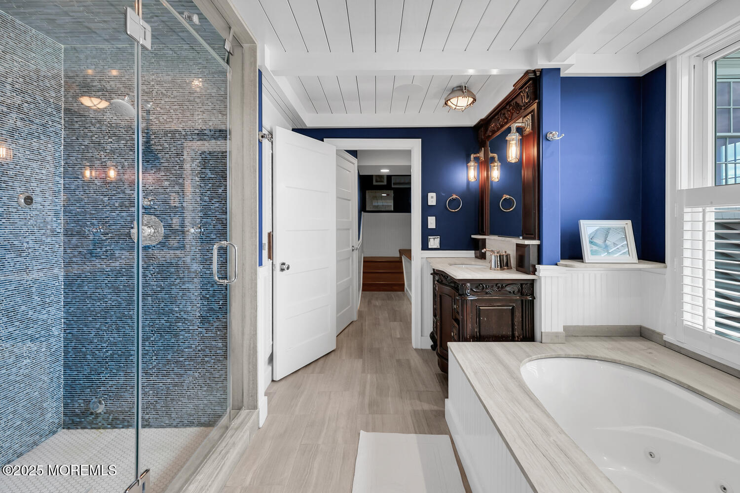 1 2nd Street Rumson, NJ 07760 - Photo 17 of 39 a spacious bathroom with a tub sink shower and mirror