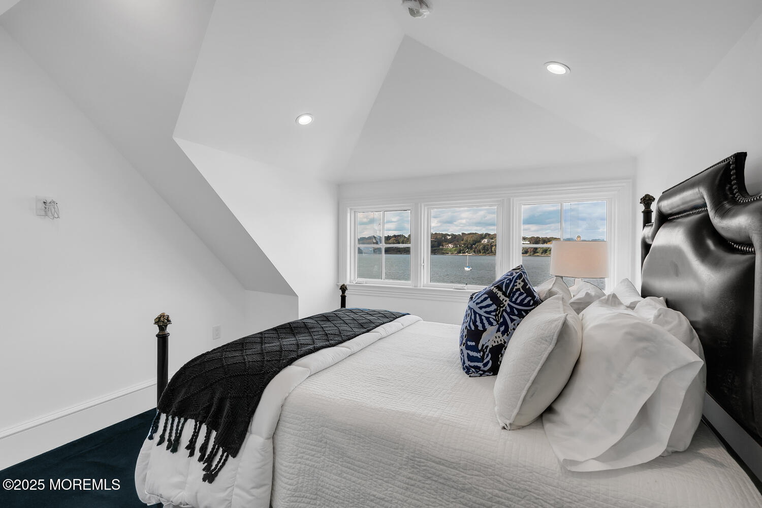 1 2nd Street Rumson, NJ 07760 - Photo 24 of 39 a bedroom with a bed and a large mirror