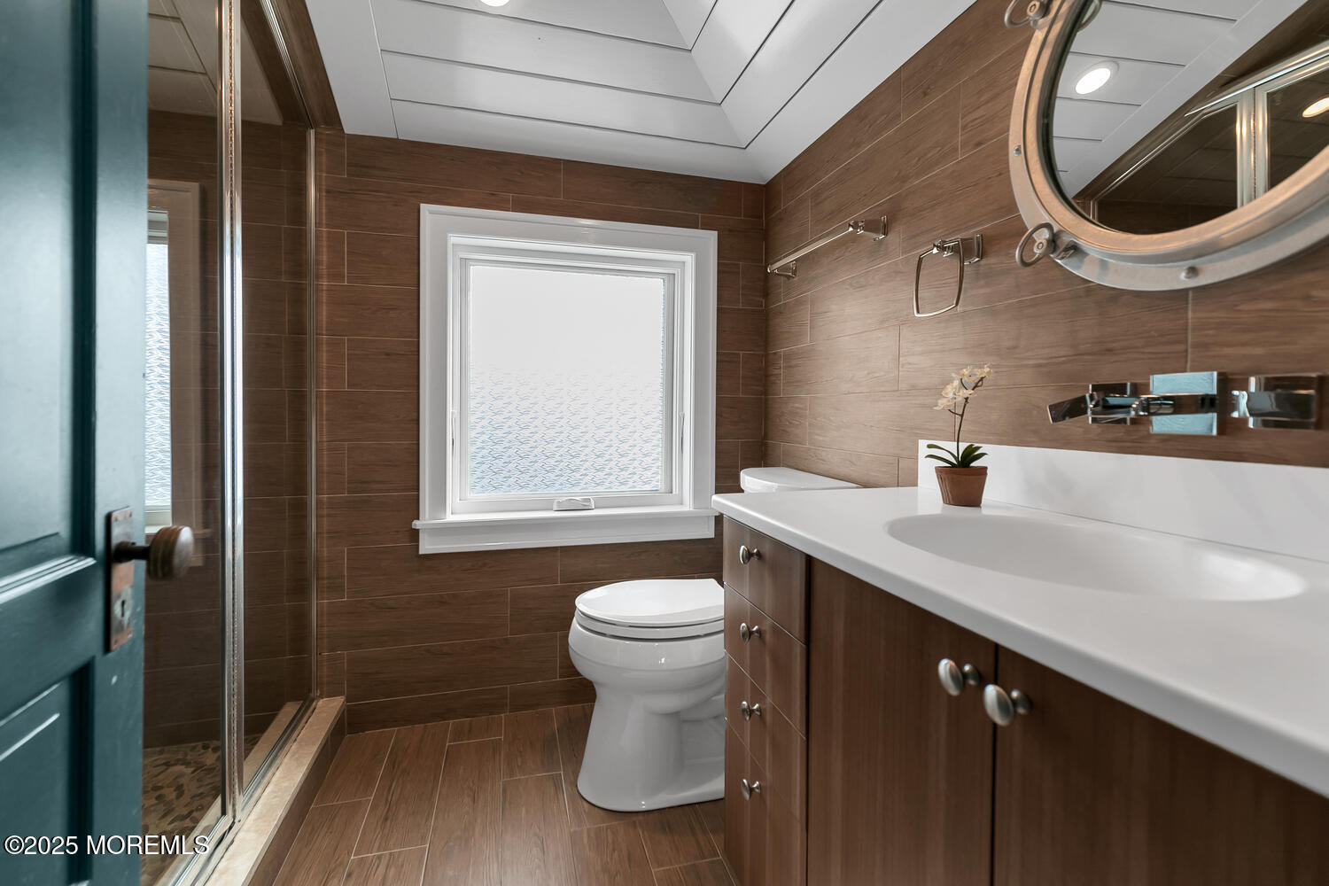 1 2nd Street Rumson, NJ 07760 - Photo 32 of 39 a bathroom with a sink a toilet and a mirror