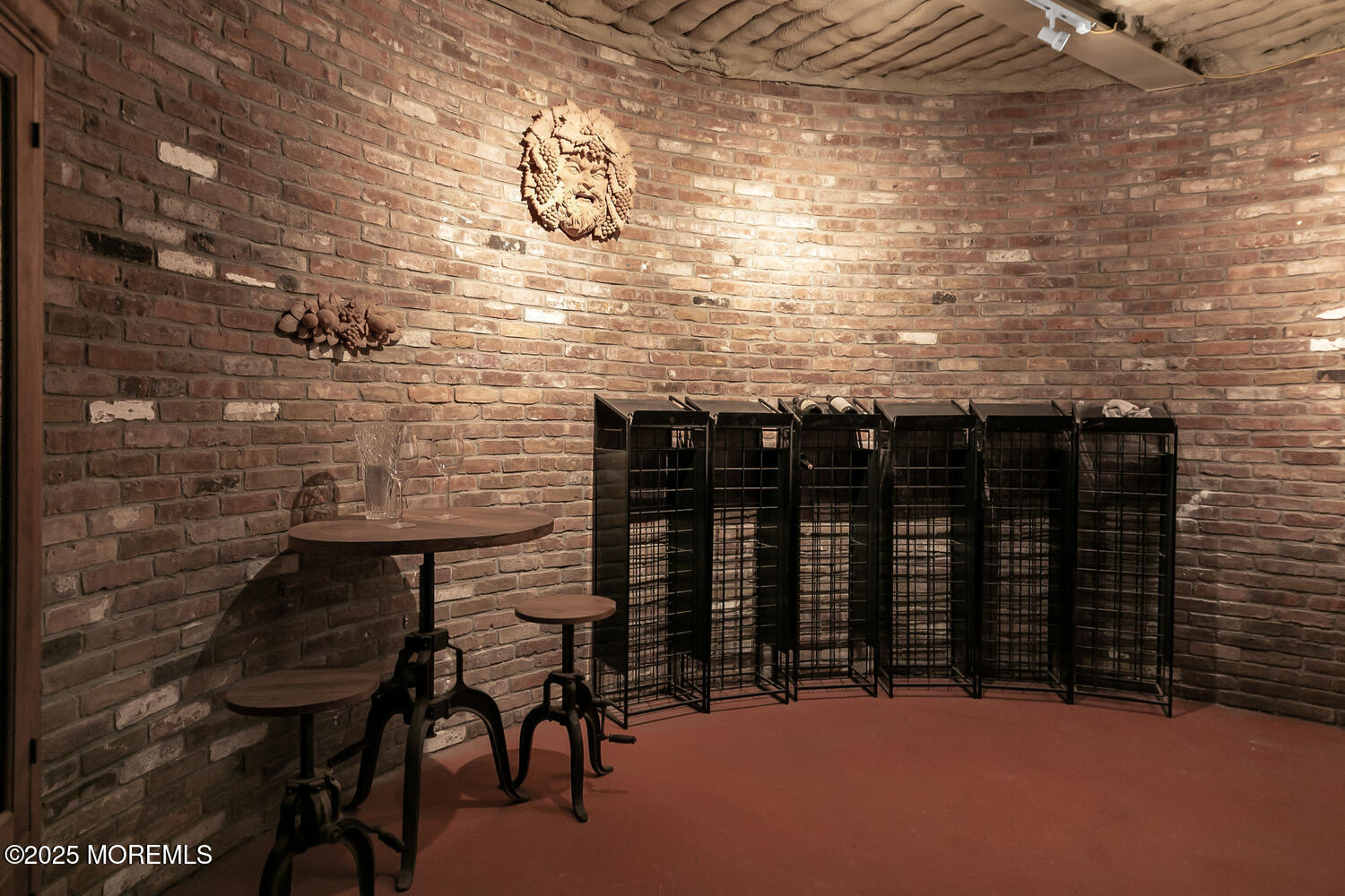 1 2nd Street Rumson, NJ 07760 - Photo 33 of 39 a table with wine bottles sitting on top of a table