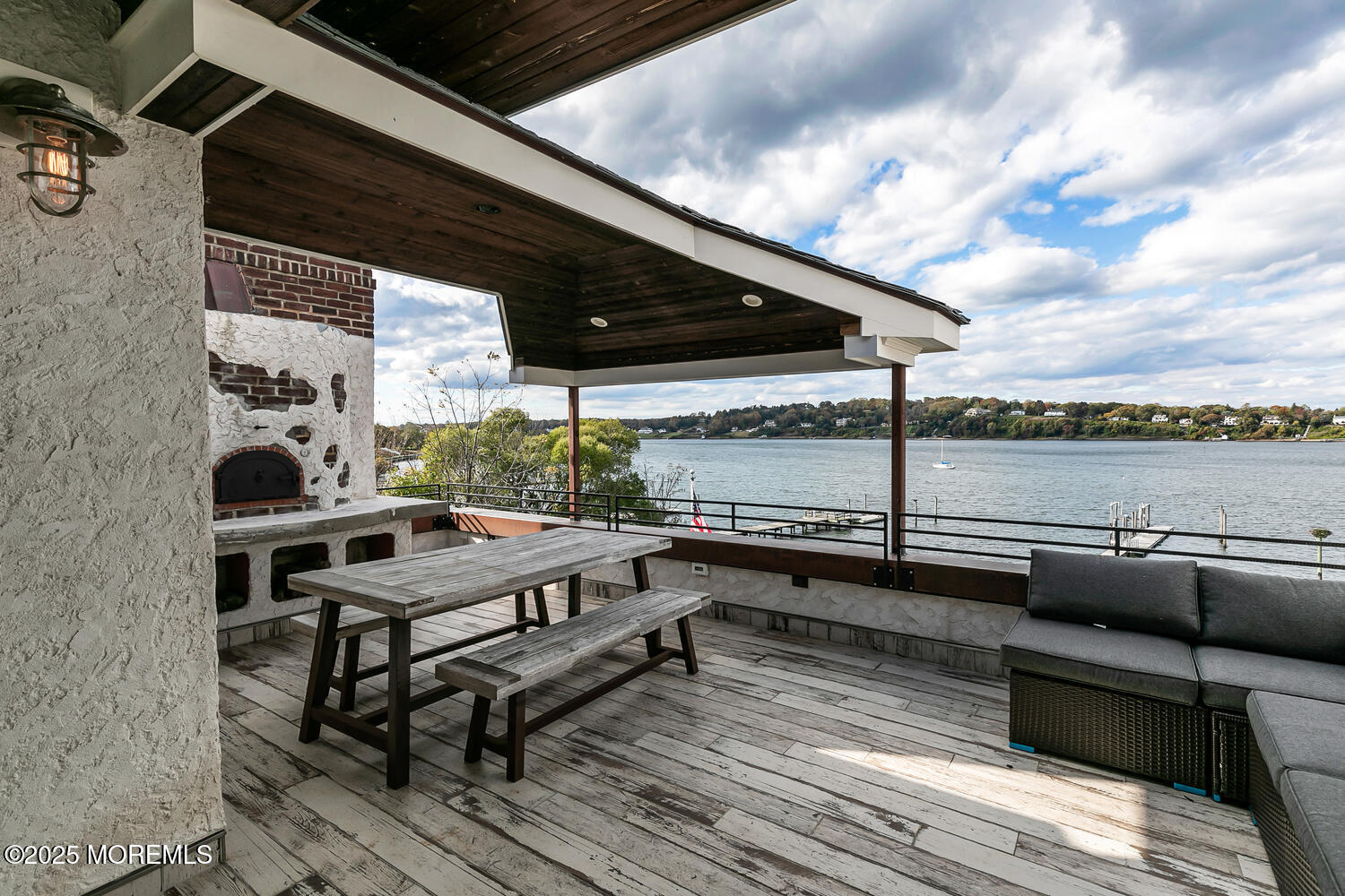 1 2nd Street Rumson, NJ 07760 - Photo 35 of 39 a roof deck view with table and chairs and wooden floor