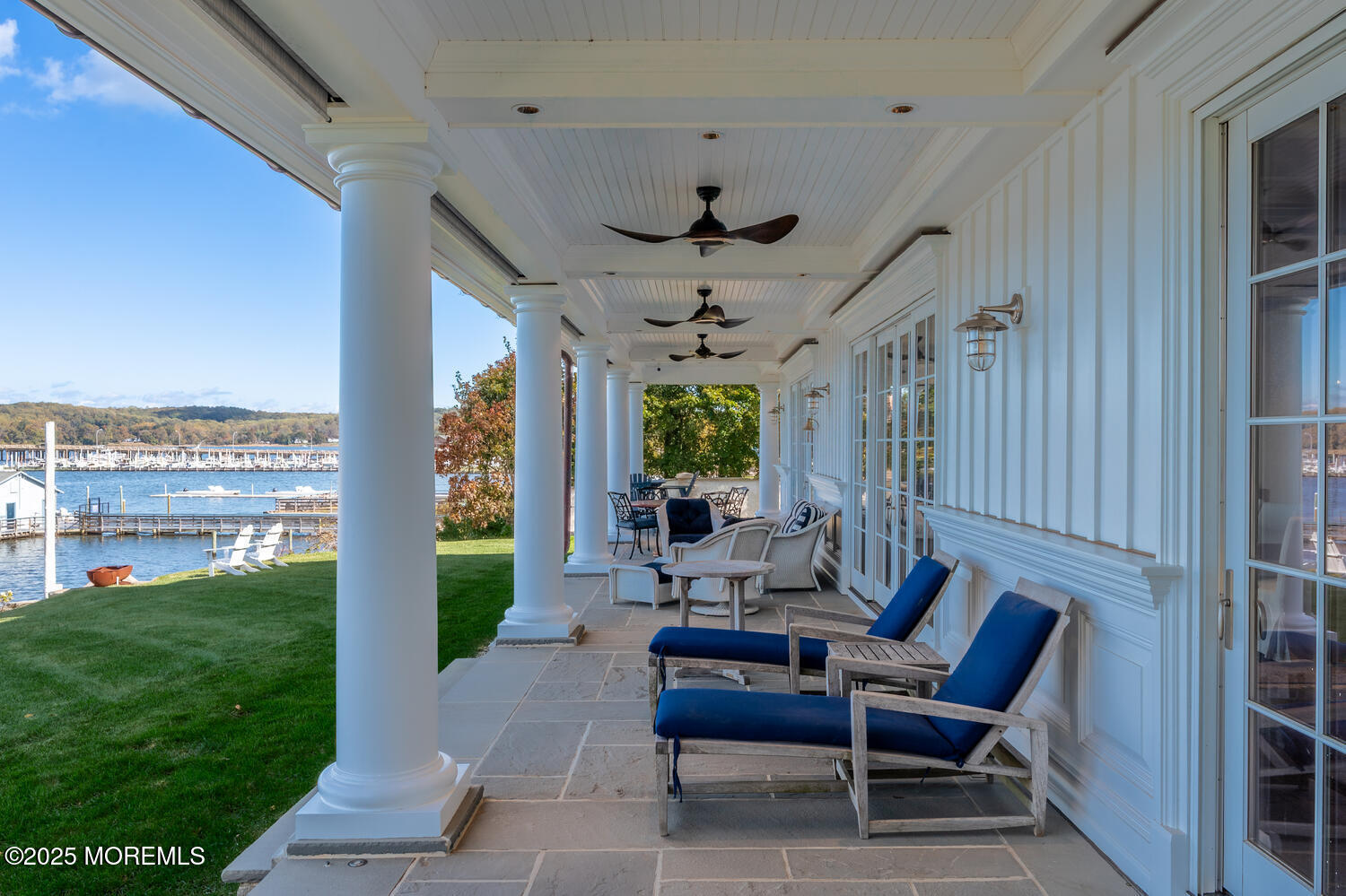 1 2nd Street Rumson, NJ 07760 - Photo 37 of 39 a view of a patio with couches chairs and a potted plant