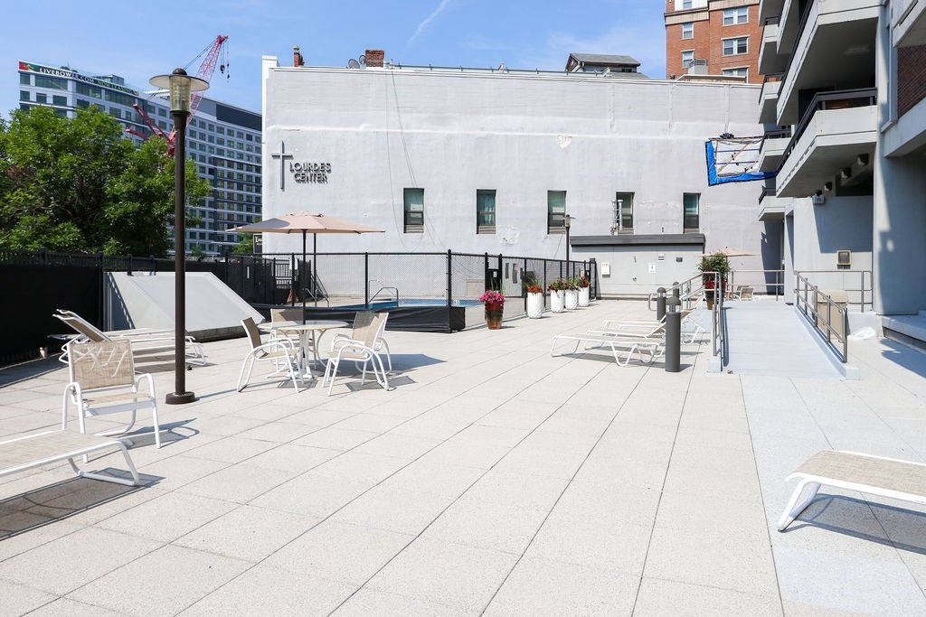 566 Commonwealth Avenue, Unit 710 Boston, MA 02215 - Photo 26 of 31 a outdoor space with lots of white furniture