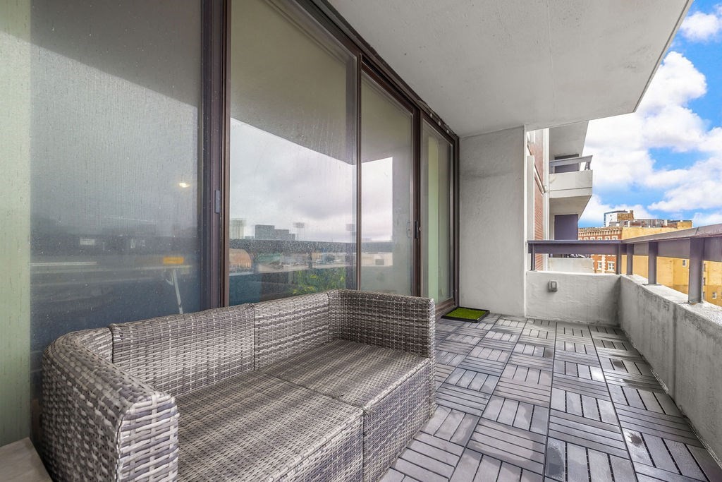 566 Commonwealth Avenue, Unit 710 Boston, MA 02215 - Photo 9 of 31 a living room with a large window and a table