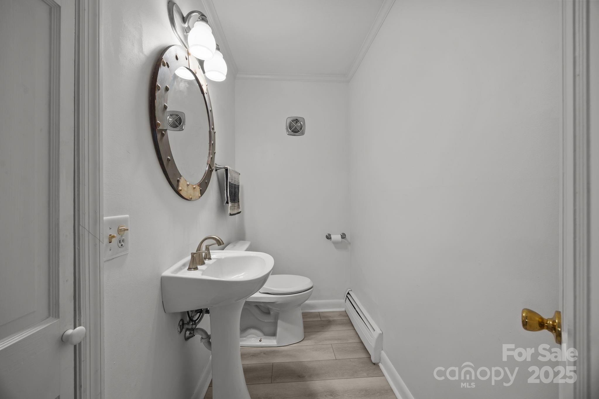 241 Stonewall Road Salisbury, NC 28144 - Photo 17 of 48 a bathroom with a sink and mirror with toilet