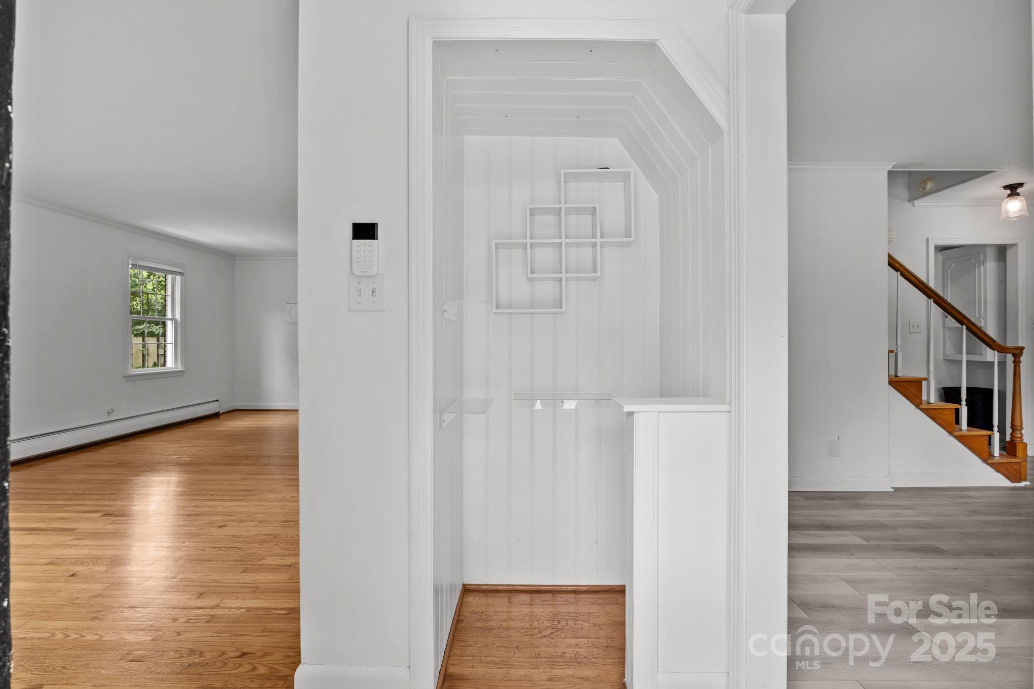241 Stonewall Road Salisbury, NC 28144 - Photo 19 of 48 a view of a room with wooden floor and staircase