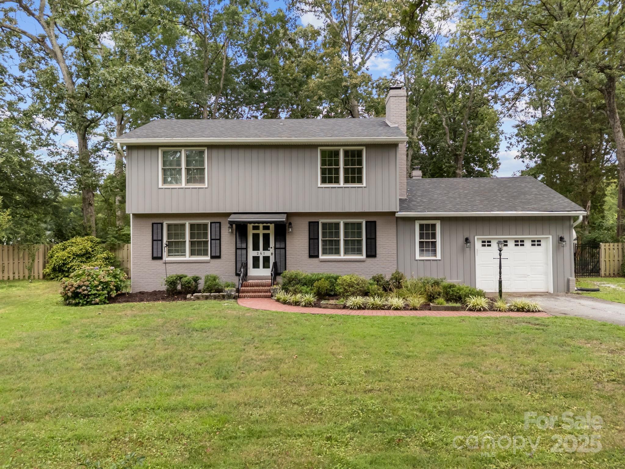241 Stonewall Road Salisbury, NC 28144 - Photo 2 of 48 a front view of a house with a yard