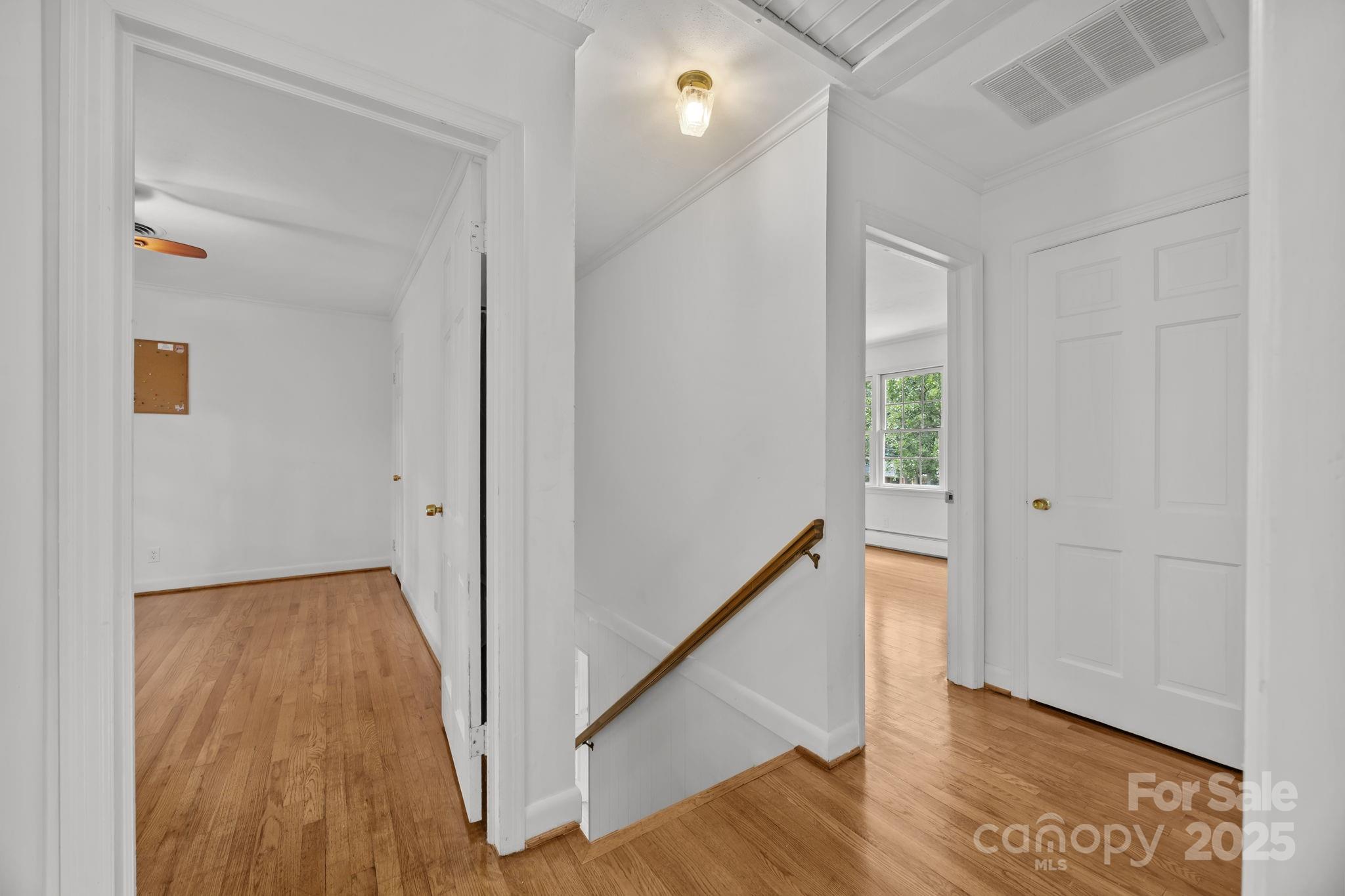 241 Stonewall Road Salisbury, NC 28144 - Photo 26 of 48 a view of a hallway with wooden floor and staircase