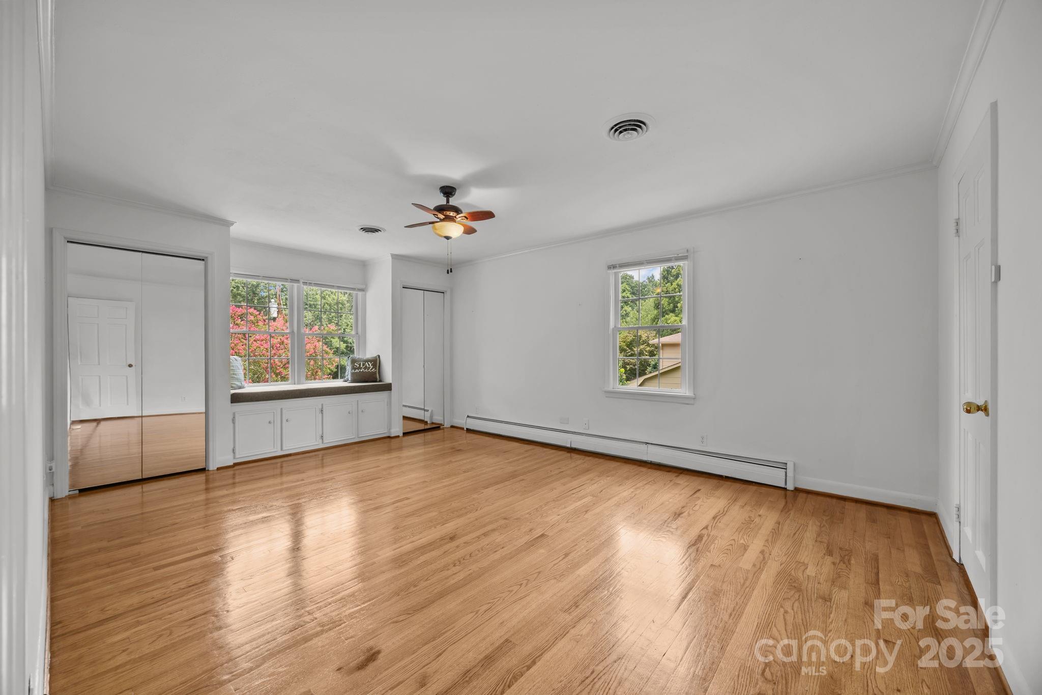 241 Stonewall Road Salisbury, NC 28144 - Photo 28 of 48 a view of an empty room with window and wooden floor