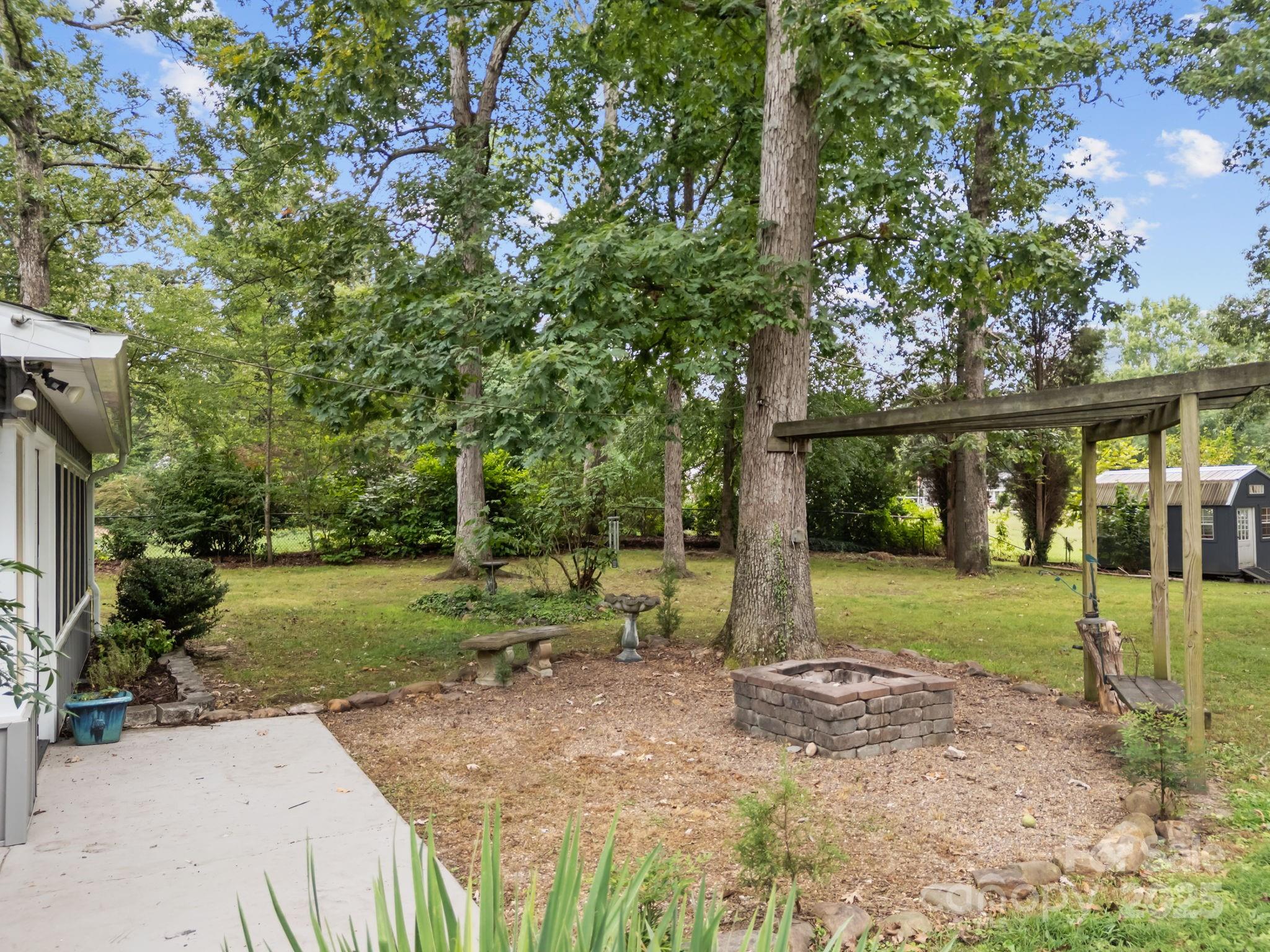 241 Stonewall Road Salisbury, NC 28144 - Photo 43 of 48 a view of a backyard with large trees