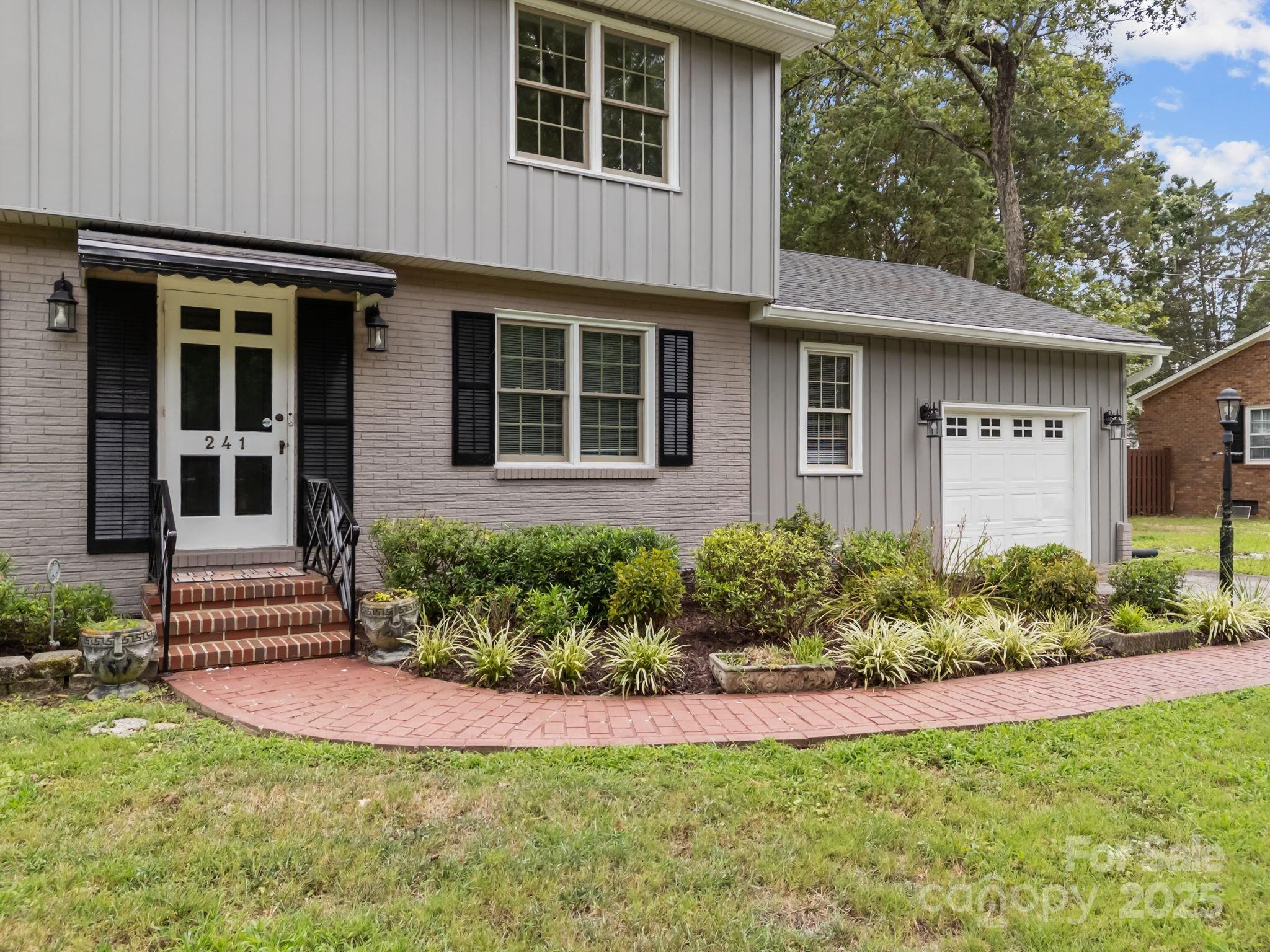 241 Stonewall Road Salisbury, NC 28144 - Photo 5 of 48 front view of a house with a yard