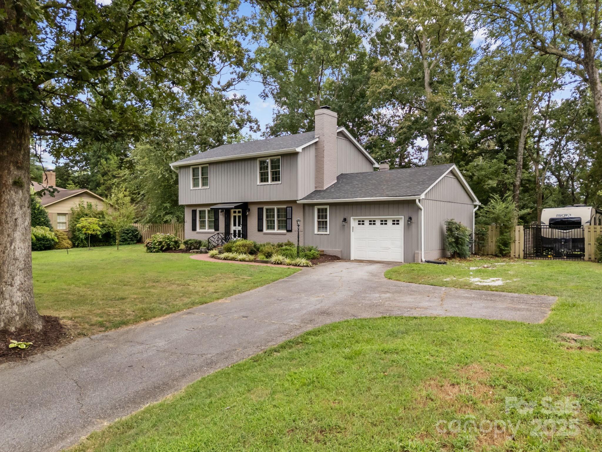 241 Stonewall Road Salisbury, NC 28144 - Photo 6 of 48 a view of an house with backyard space and garden