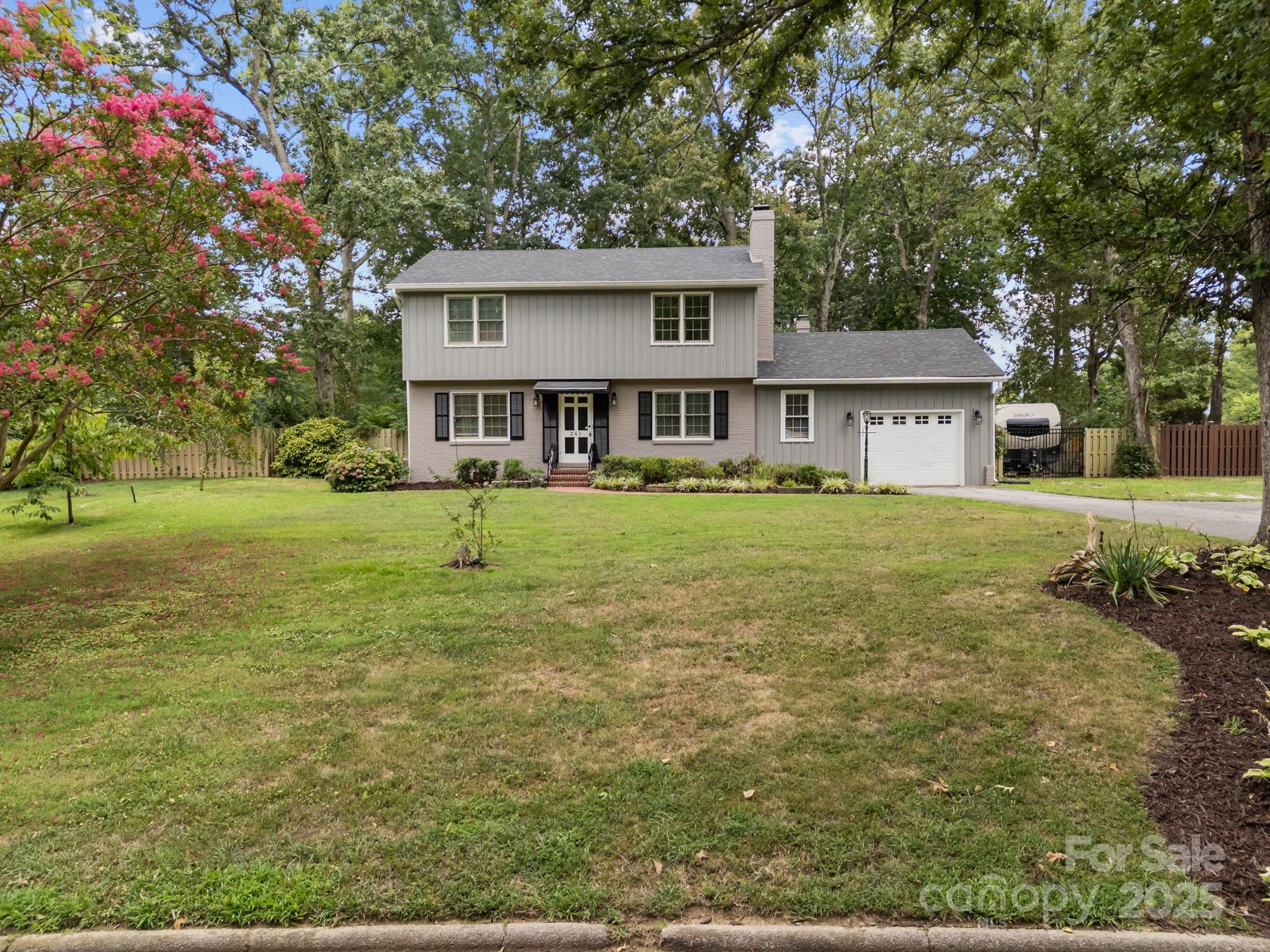 241 Stonewall Road Salisbury, NC 28144 - Photo 7 of 48 a front view of a house with a yard