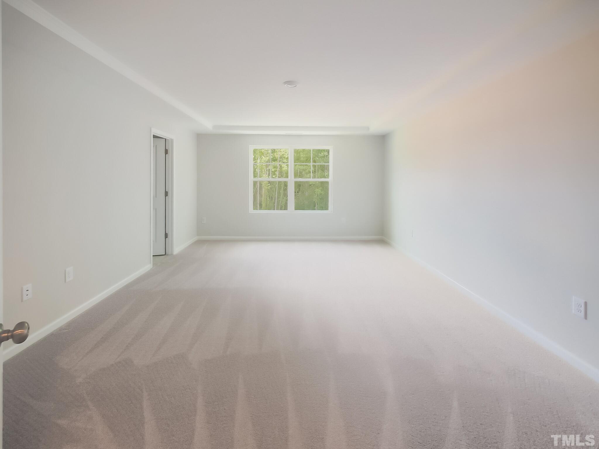 1623 Emory Ridge Way Wake Forest, NC 27587 - Photo 15 of 25 a view of an empty room with a window