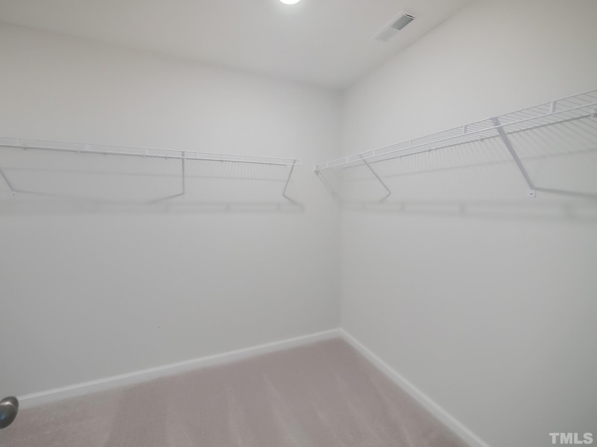 1623 Emory Ridge Way Wake Forest, NC 27587 - Photo 18 of 25 a view of a rack on the wall