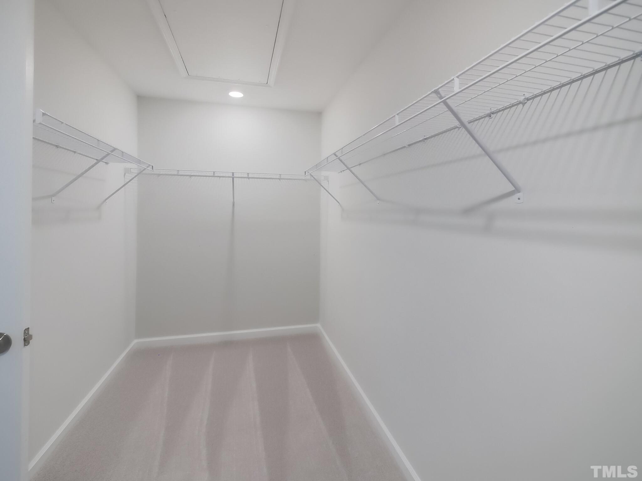 1623 Emory Ridge Way Wake Forest, NC 27587 - Photo 19 of 25 a view of a room with racks on the wall