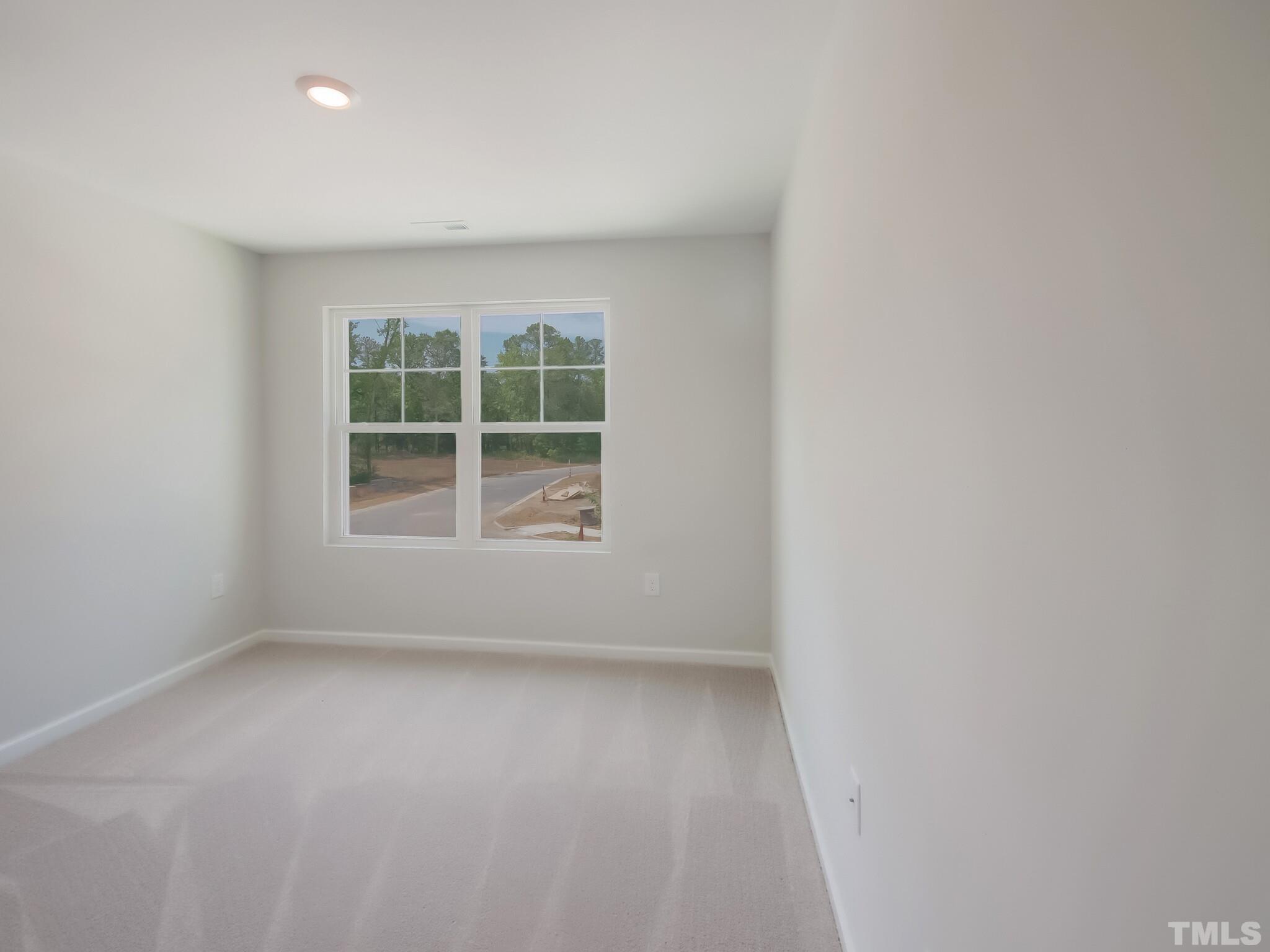 1623 Emory Ridge Way Wake Forest, NC 27587 - Photo 24 of 25 an empty room with a window